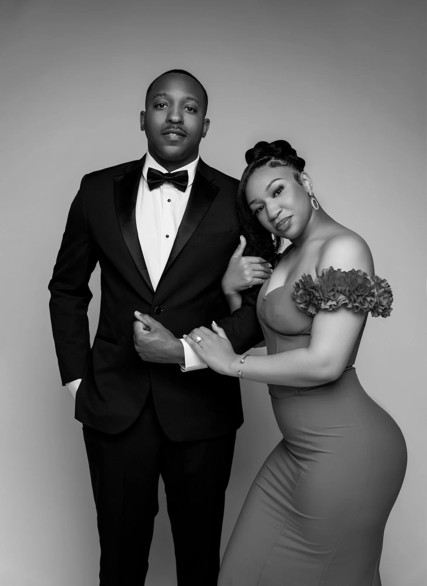 Black and white closeup engagement photo, couple in formal attire, intimate studio portrait at Filaneyka Chicago