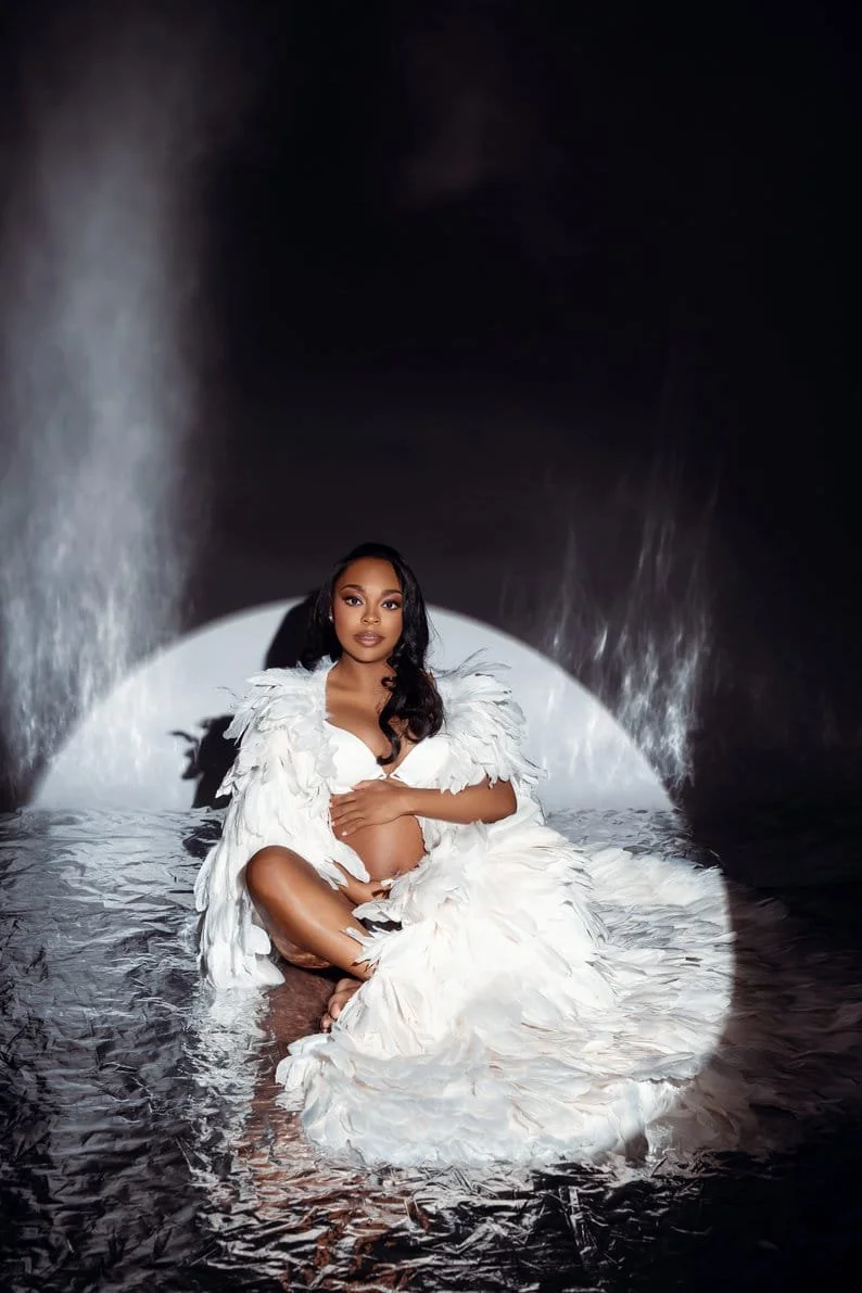 Maternity exclusive retouching with angelic pregnant woman with white feathers in Chicago - Filaneyka photo studio