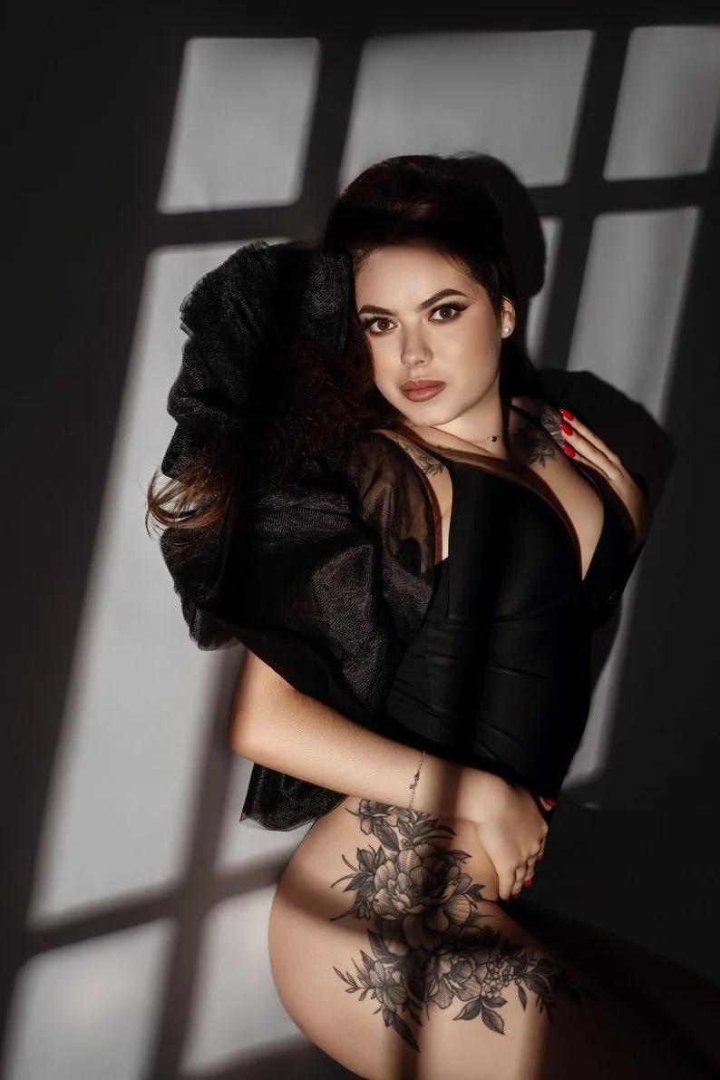 Professional headshot photography with tattooed woman in window light boudoir in Chicago - Filaneyka photo studio