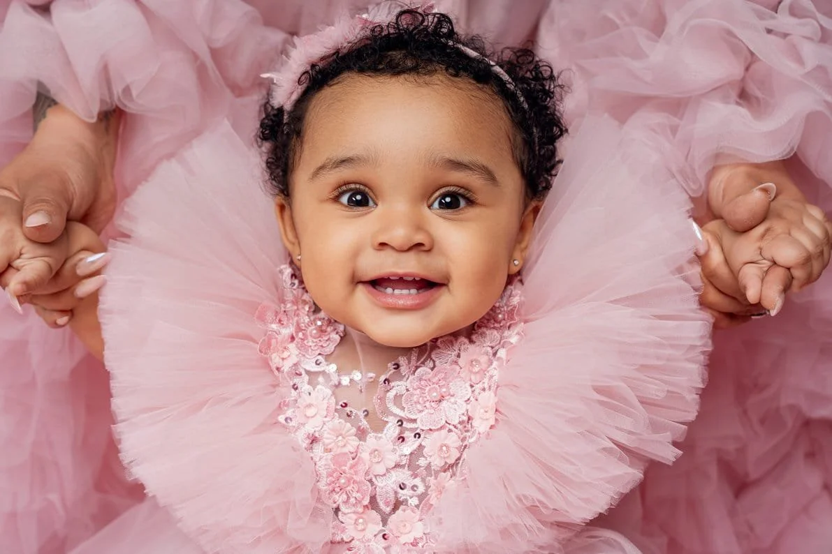 First birthday portrait with smiling baby in pink tutu closeup in Chicago - Filaneyka photo studio