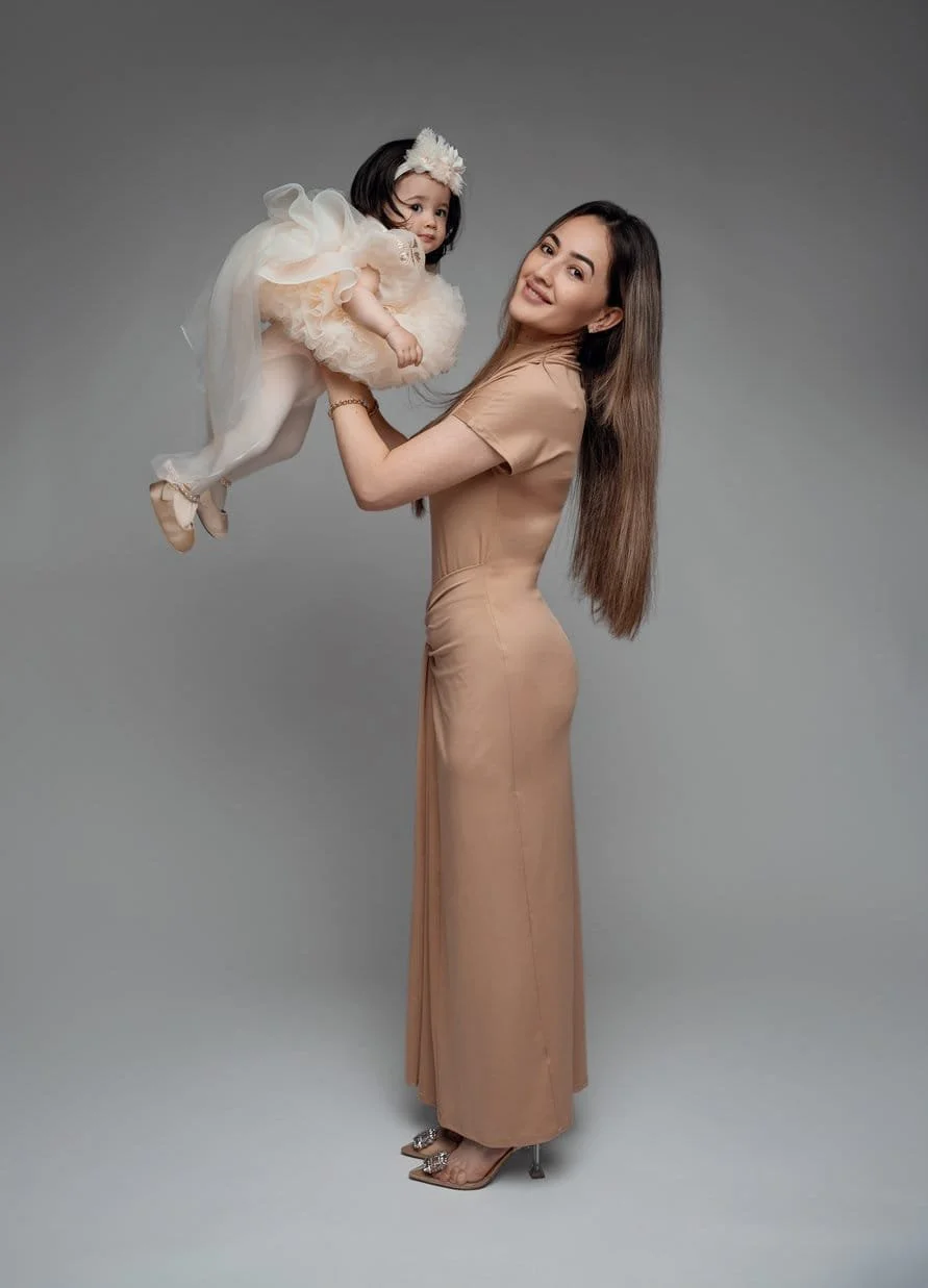 First birthday portrait with mother lifting baby in elegant beige in Chicago - Filaneyka photo studio