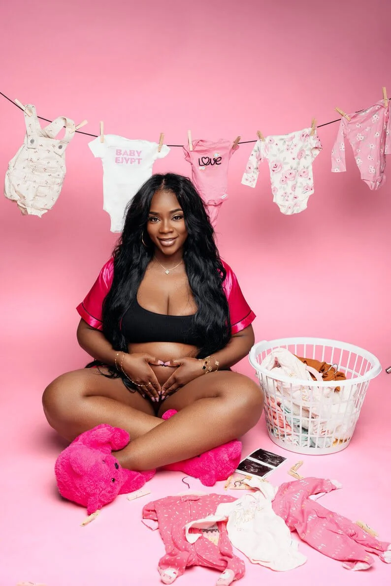 Maternity photoshoot with pink baby clothes maternity shoot in Chicago - Filaneyka photo studio