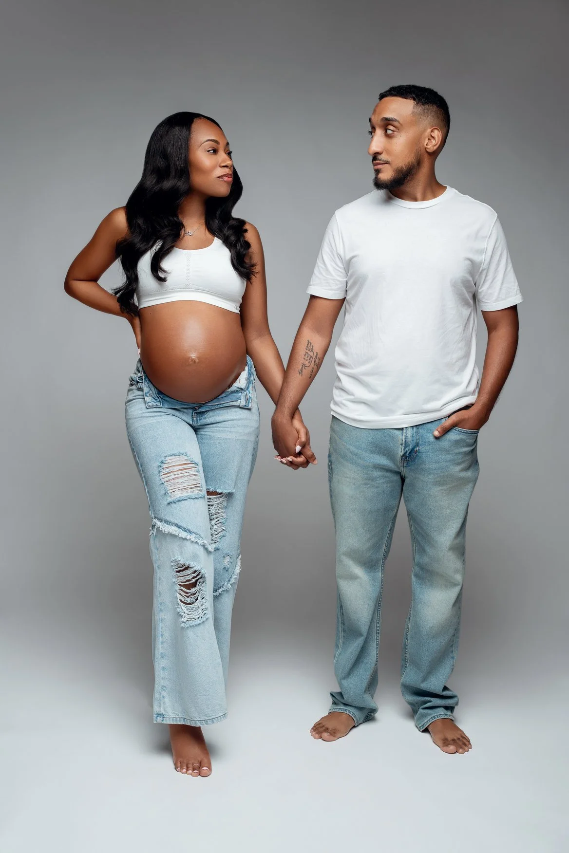 Maternity portrait session with casual couple holding hands in Chicago - Filaneyka photo studio
