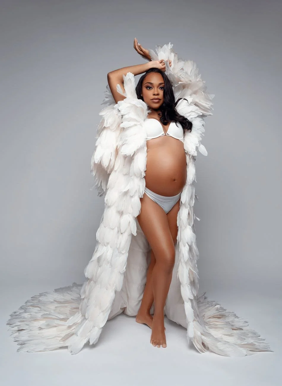 Pregnancy photography with feather robe pregnant standing pose in Chicago - Filaneyka photo studio