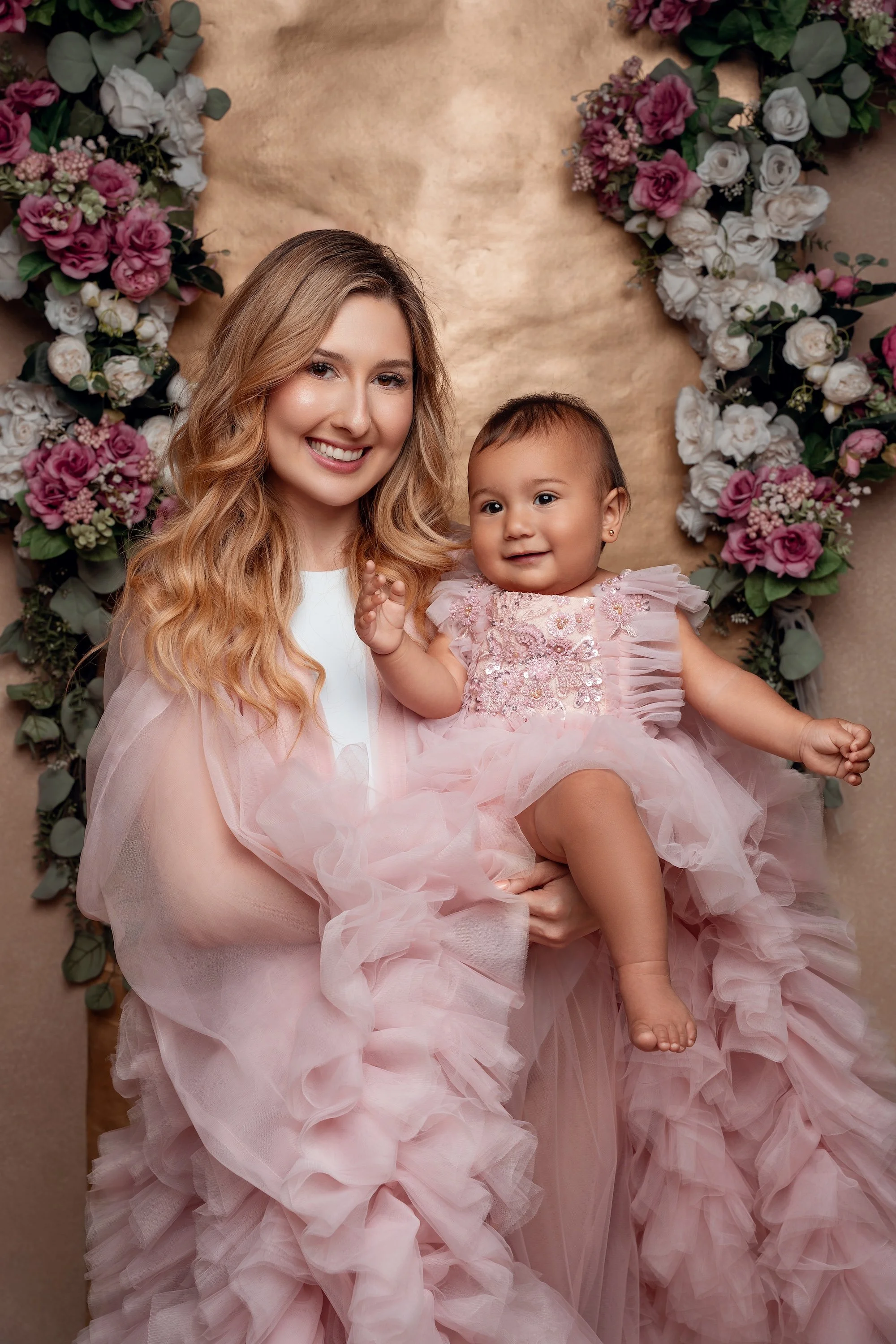 First birthday portrait with mother and baby in pink ruffled dresses in Chicago - Filaneyka photo studio
