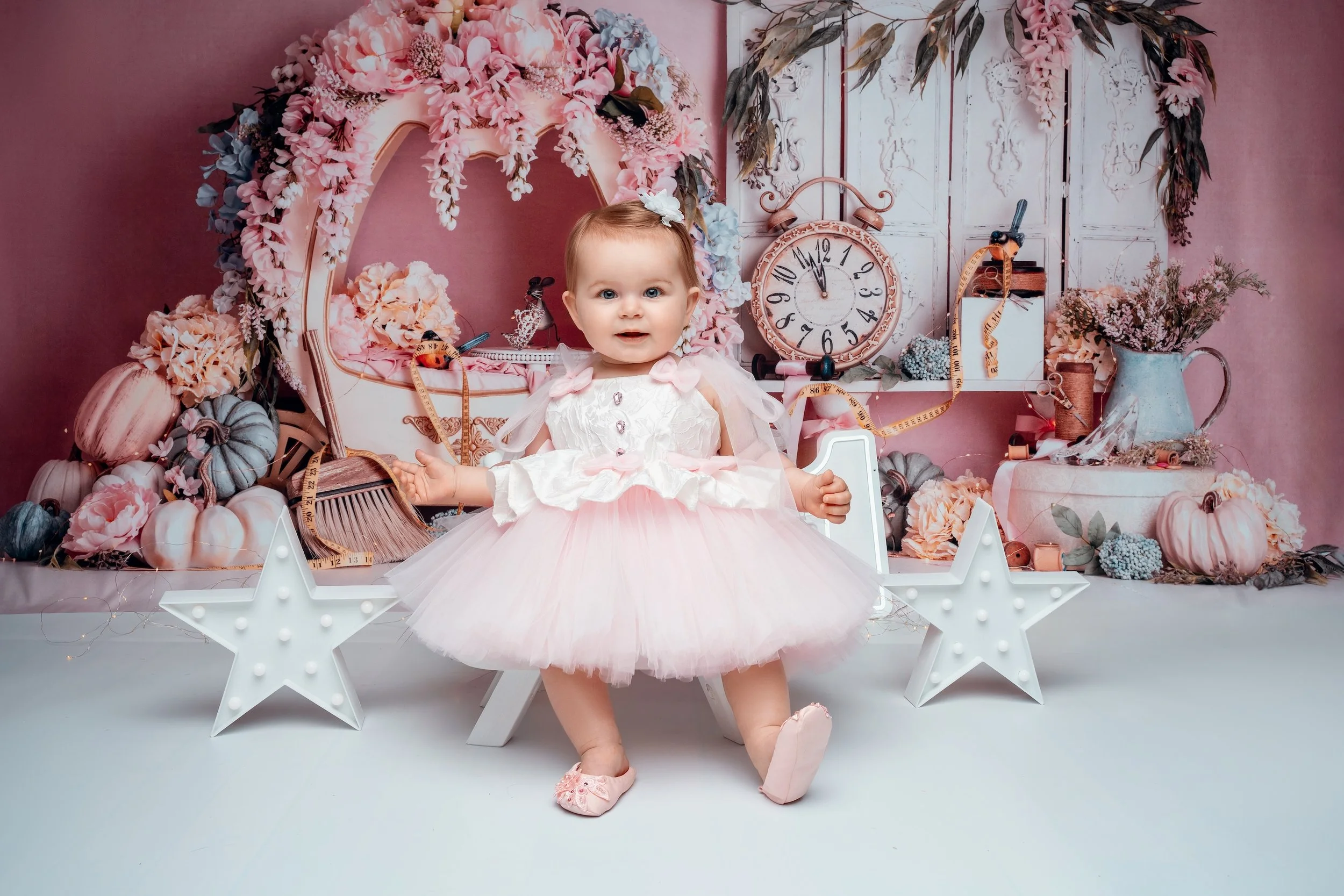 First birthday photoshoot with baby girl in pink tutu with pumpkin decor in Chicago - Filaneyka photo studio