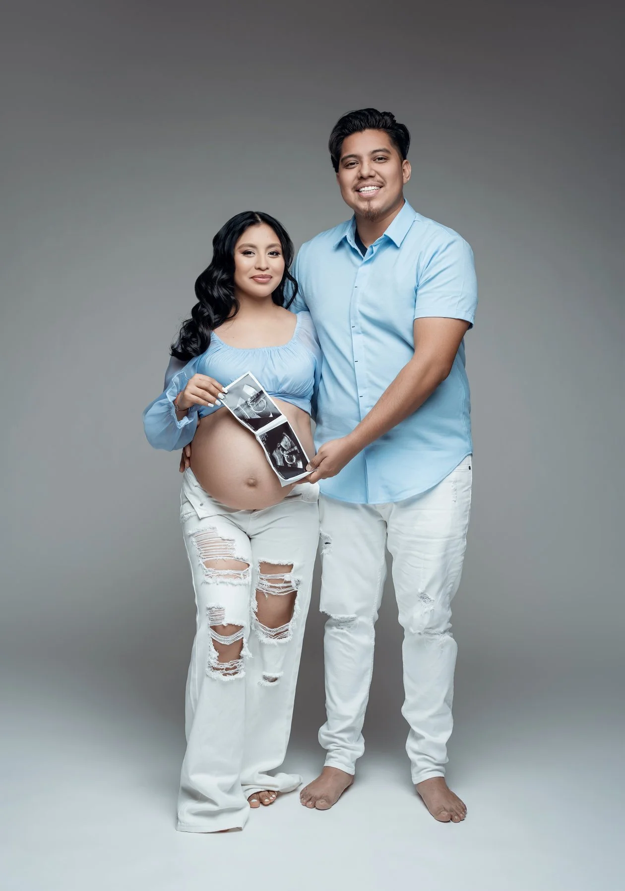 Prenatal photography session with couple holding ultrasound photo in Chicago - Filaneyka photo studio