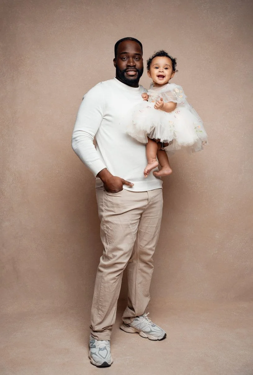 Family photography with father holding baby in tutu in Chicago - Filaneyka photo studio