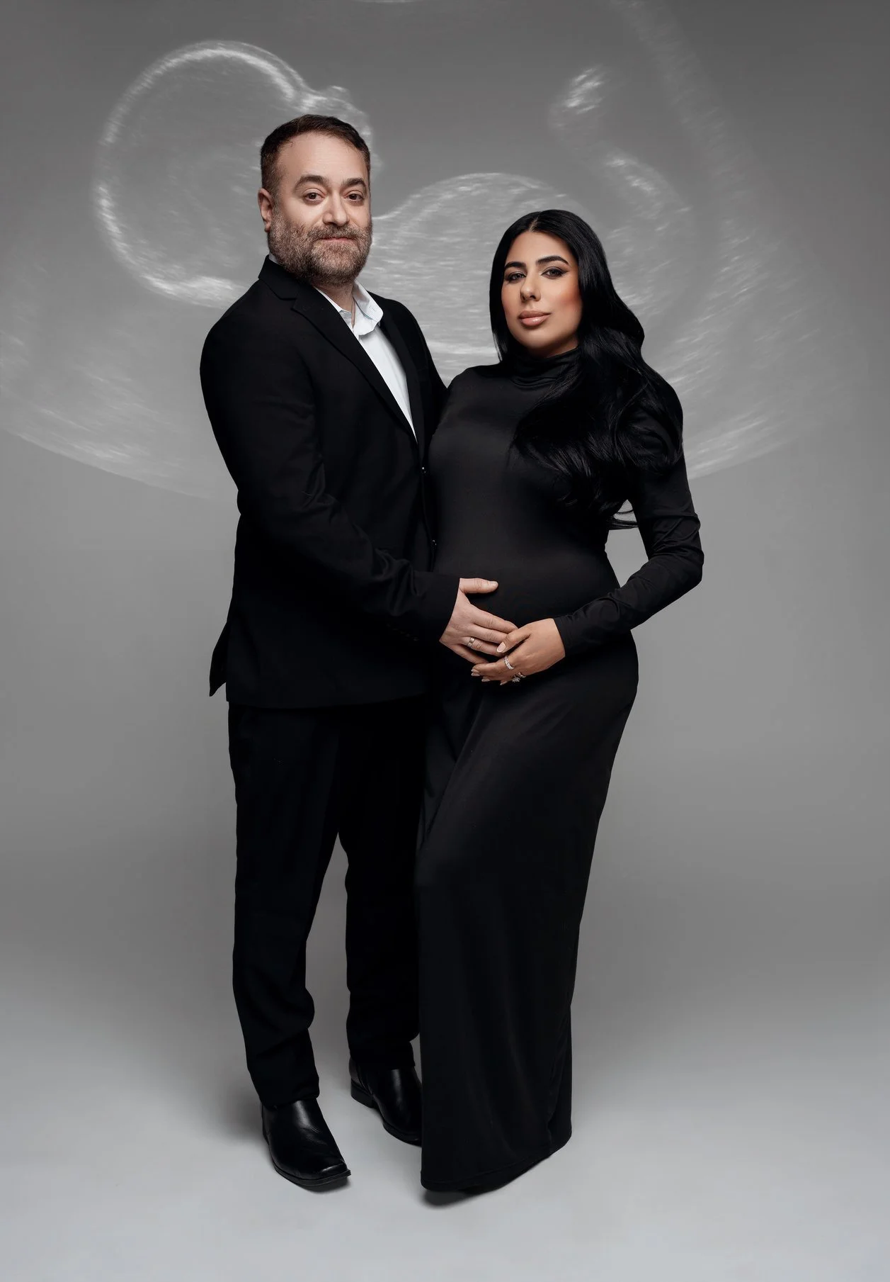Expecting mother photoshoot with formal black couple with ultrasound backdrop in Chicago - Filaneyka photo studio