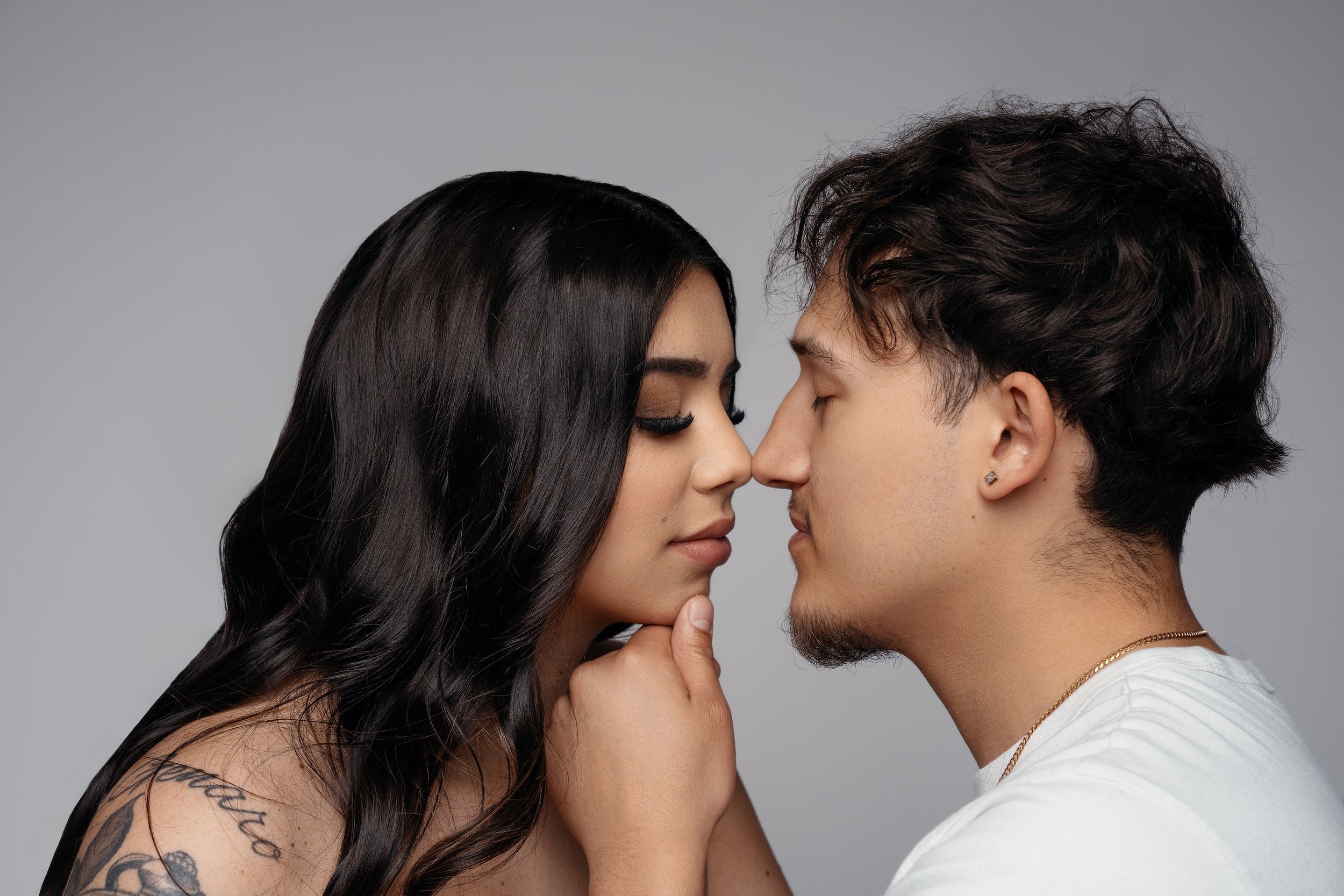 Fine-art engagement portrait: intimate couple in soft light