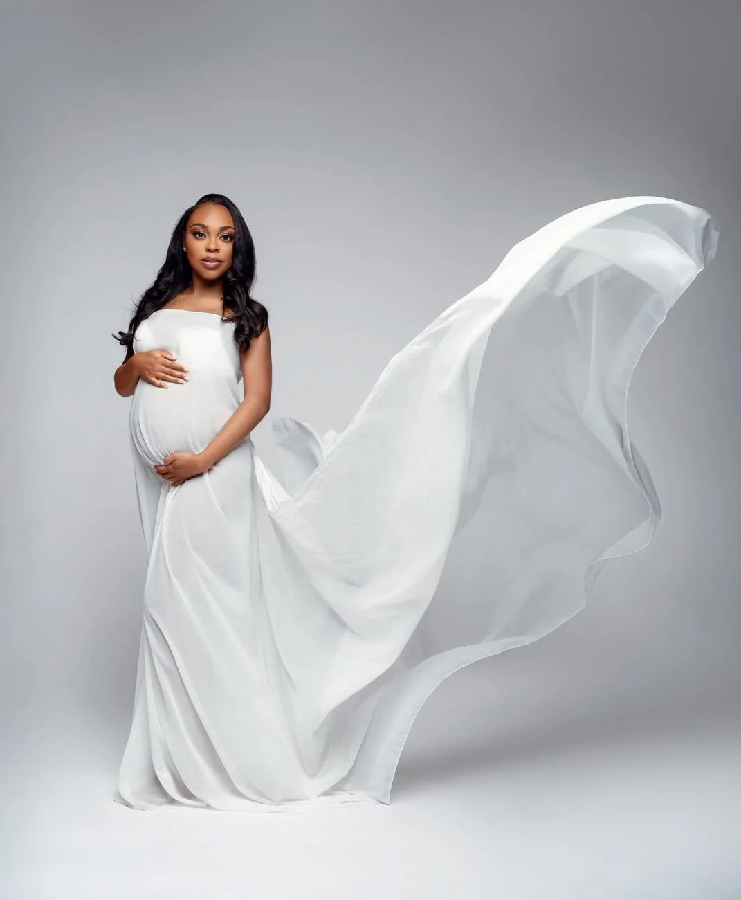 Expecting mother photoshoot with white flowing gown pregnant portrait in Chicago - Filaneyka photo studio