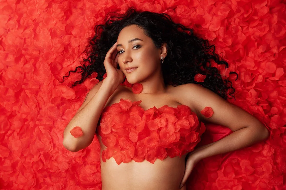 Professional portrait session with woman lying in red petals in Chicago - Filaneyka photo studio