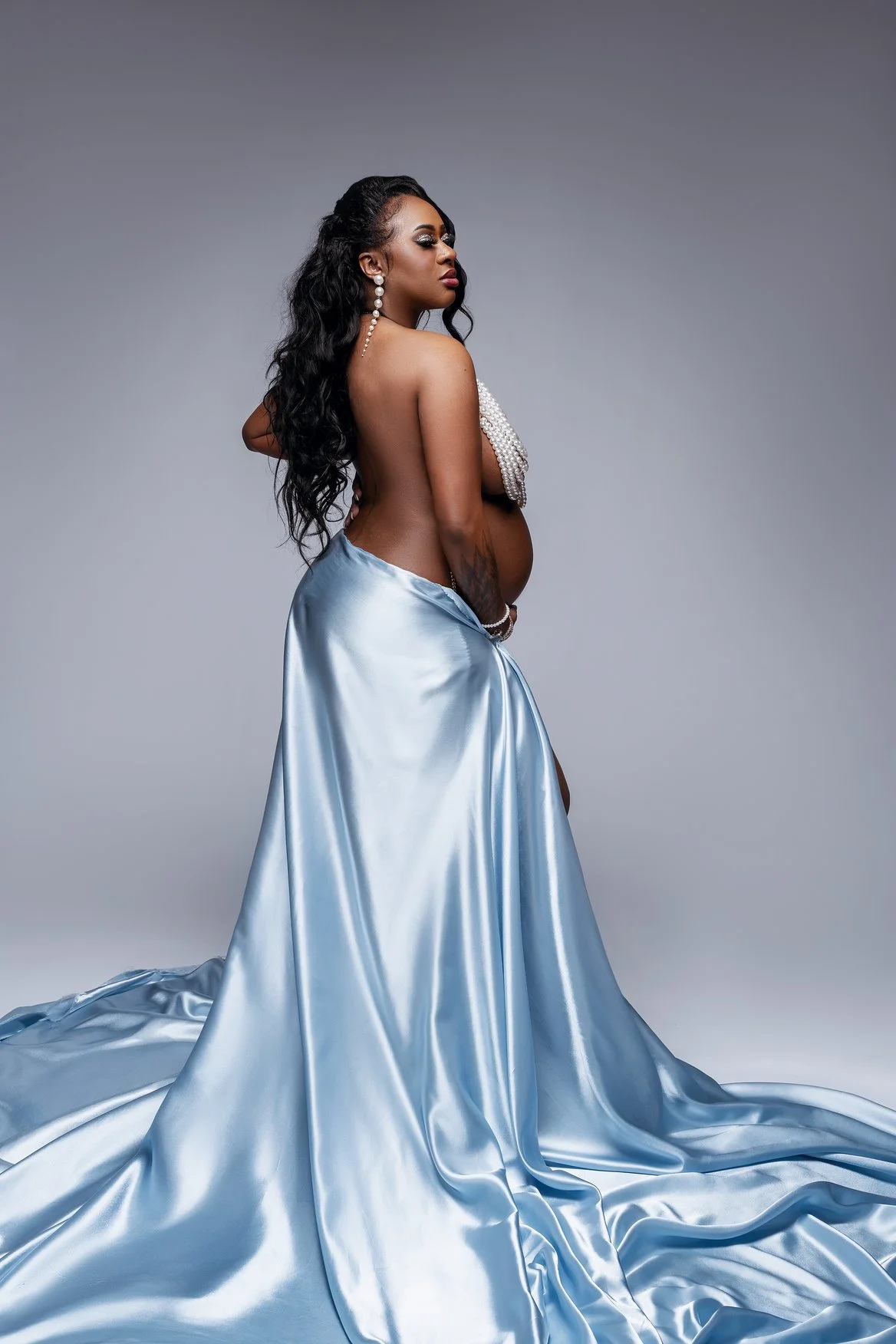 Maternity portrait session with blue satin draped maternity portrait in Chicago - Filaneyka photo studio