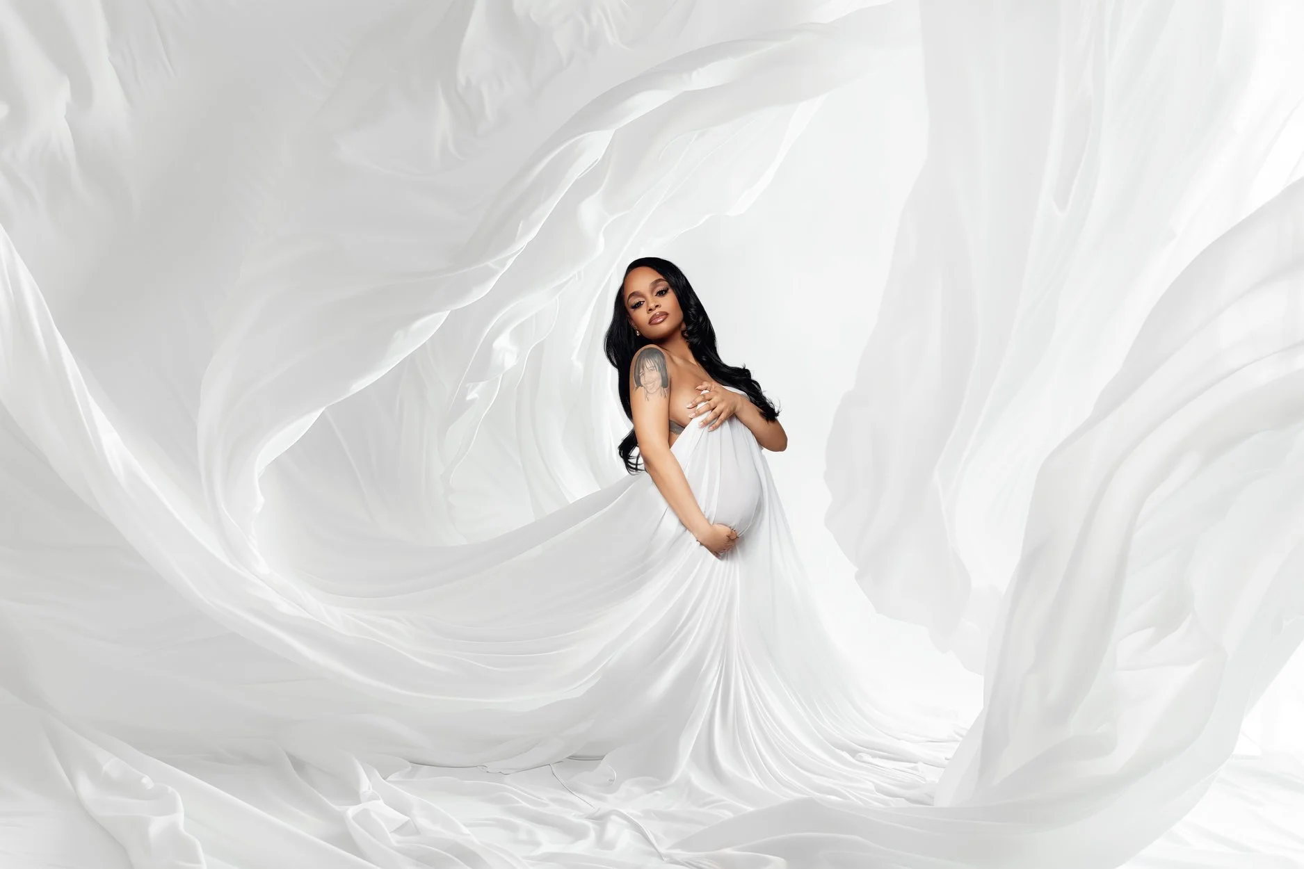 Maternity exclusive retouching with pregnant woman in white fabric in Chicago - Filaneyka photo studio