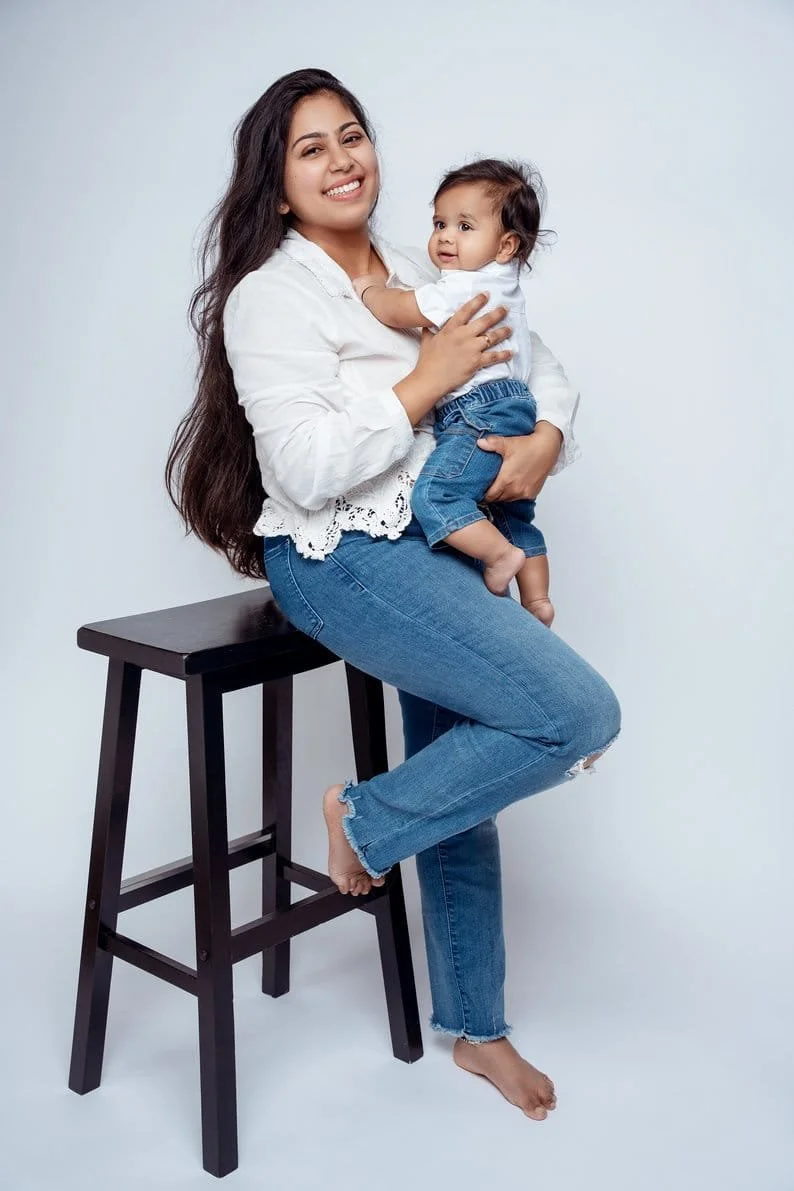 First birthday photoshoot with mother holding baby on stool in Chicago - Filaneyka photo studio
