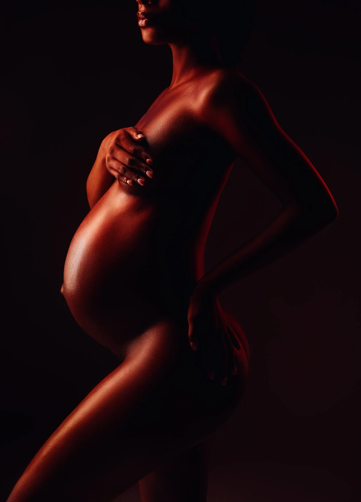 Prenatal photography session with dramatic dark maternity silhouette in Chicago - Filaneyka photo studio