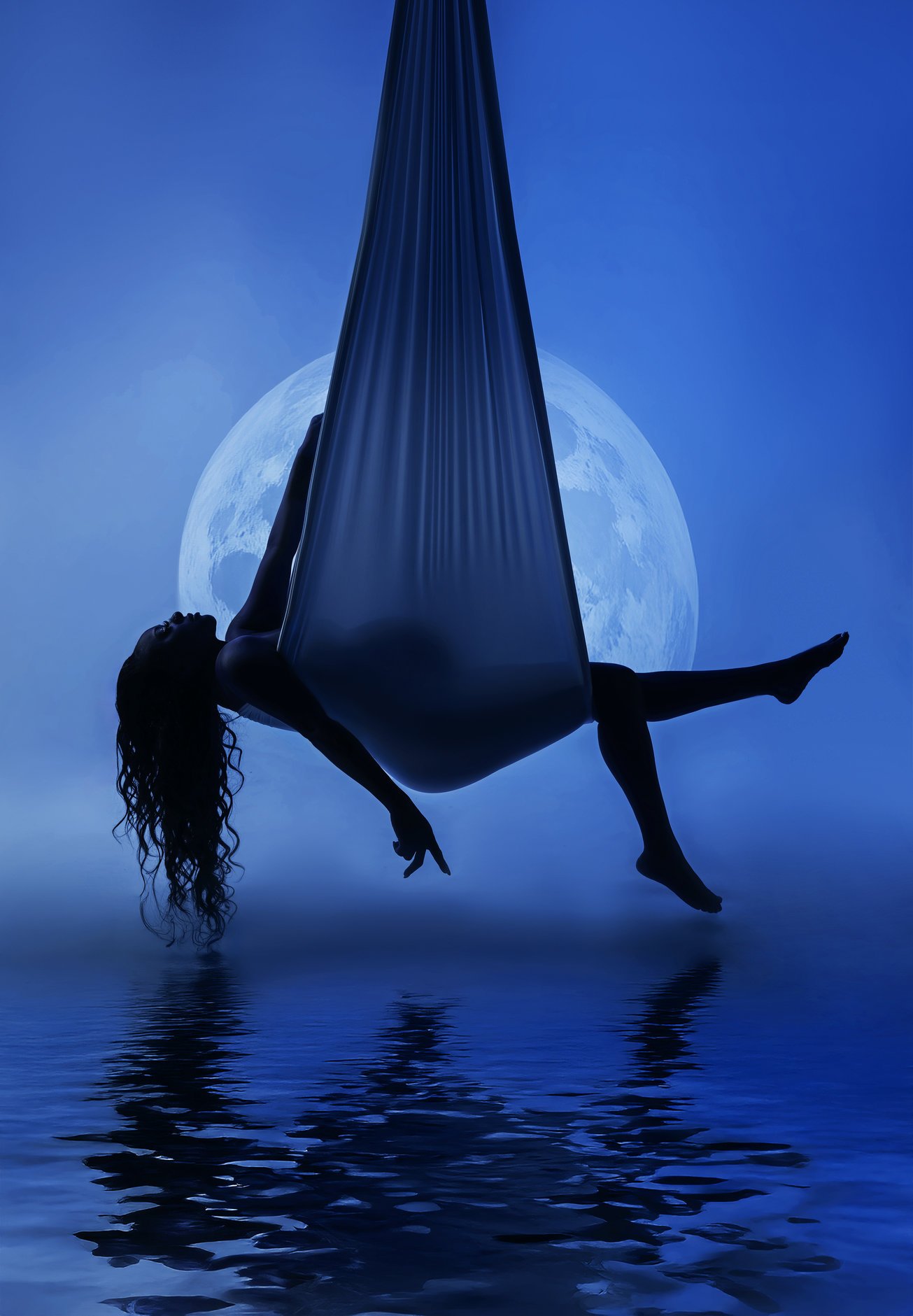 Artistic maternity edit with blue moon silk aerial silhouette in Chicago - Filaneyka photo studio