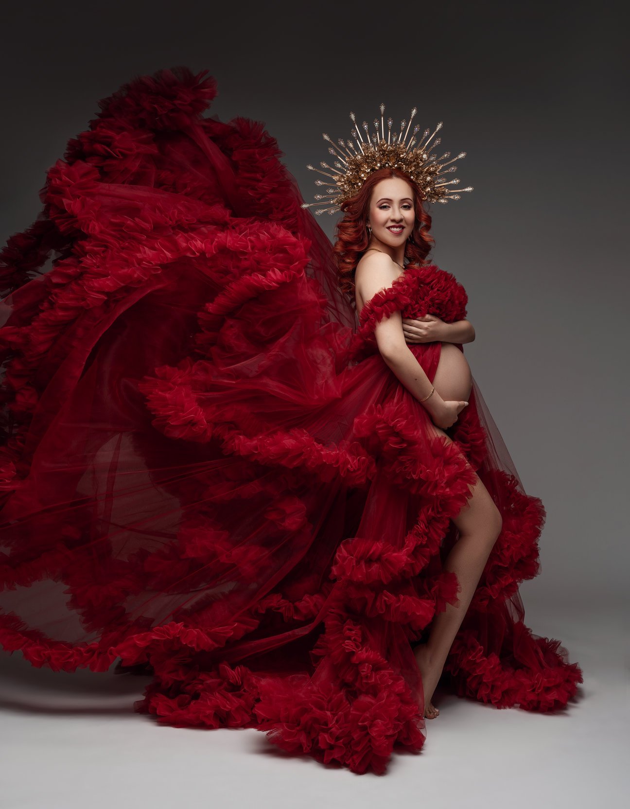 Maternity portrait session with red feathered gown with golden crown in Chicago - Filaneyka photo studio