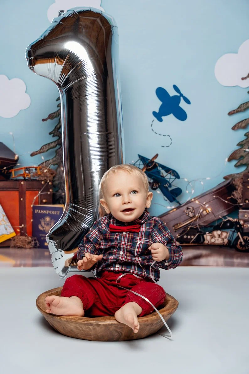 Cake smash session with baby boy aviation-themed first birthday in Chicago - Filaneyka photo studio