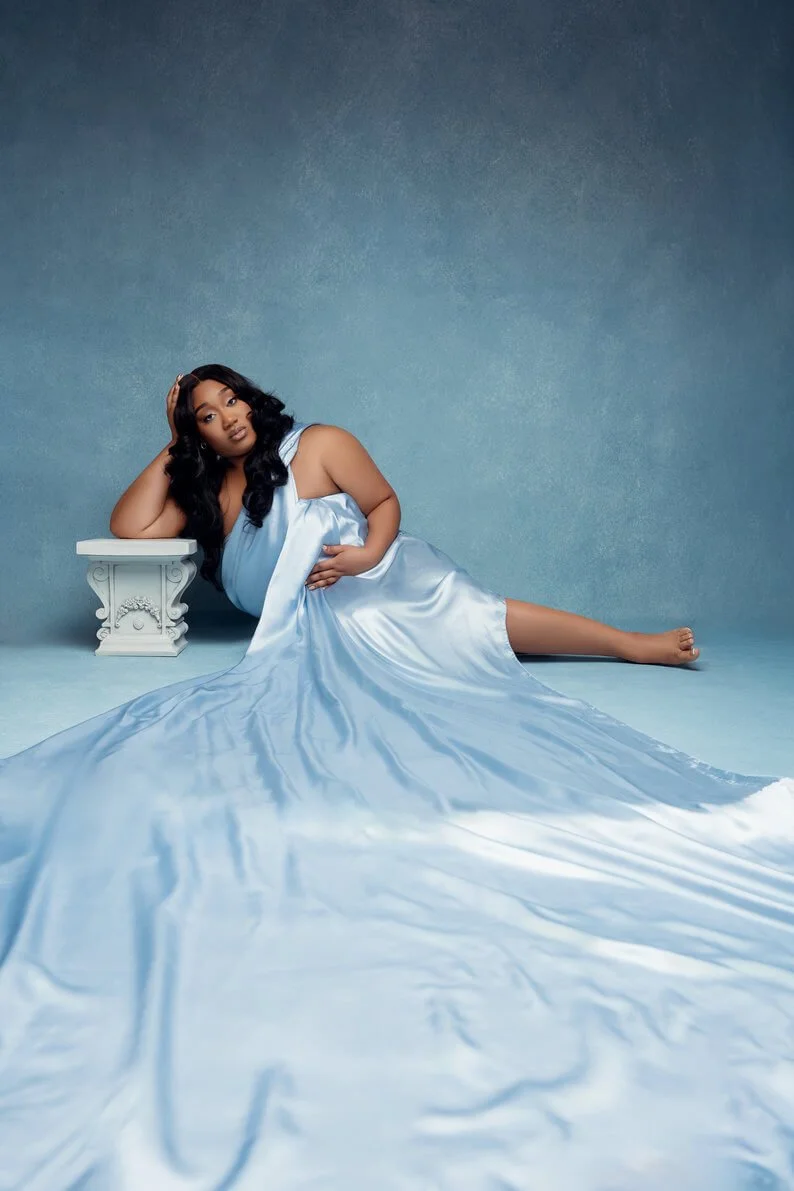 Professional portrait session with blue flowing gown reclining pose in Chicago - Filaneyka photo studio