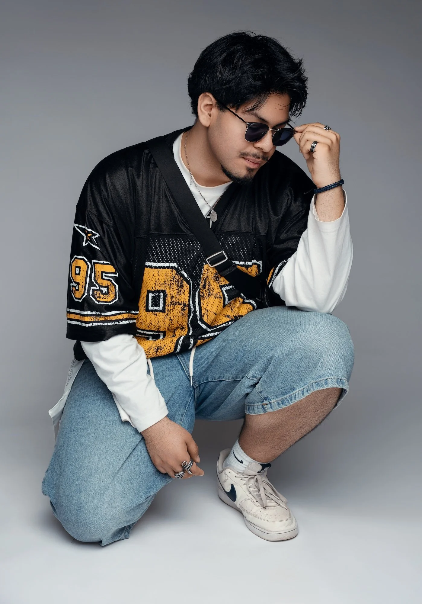 Luxury portrait: man in casual outfit posing in a studio