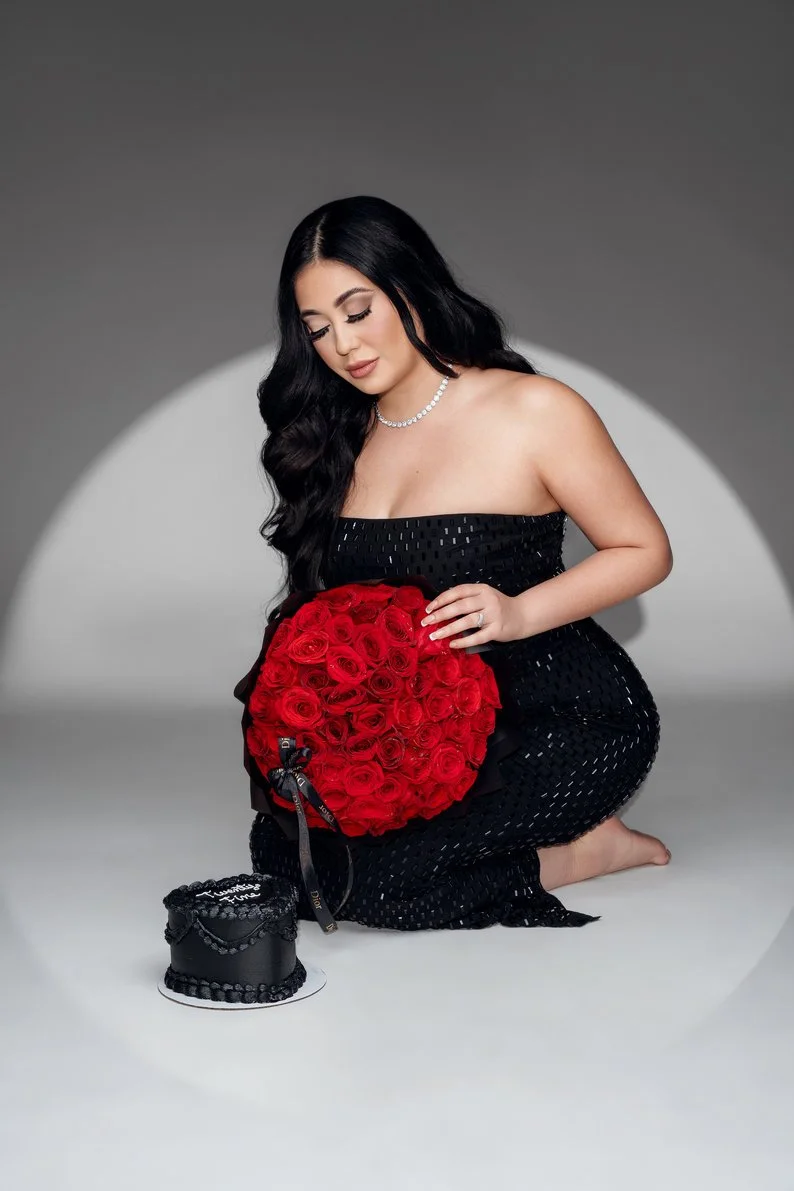 Birthday portrait session with kneeling with red rose bouquet in Chicago - Filaneyka photo studio