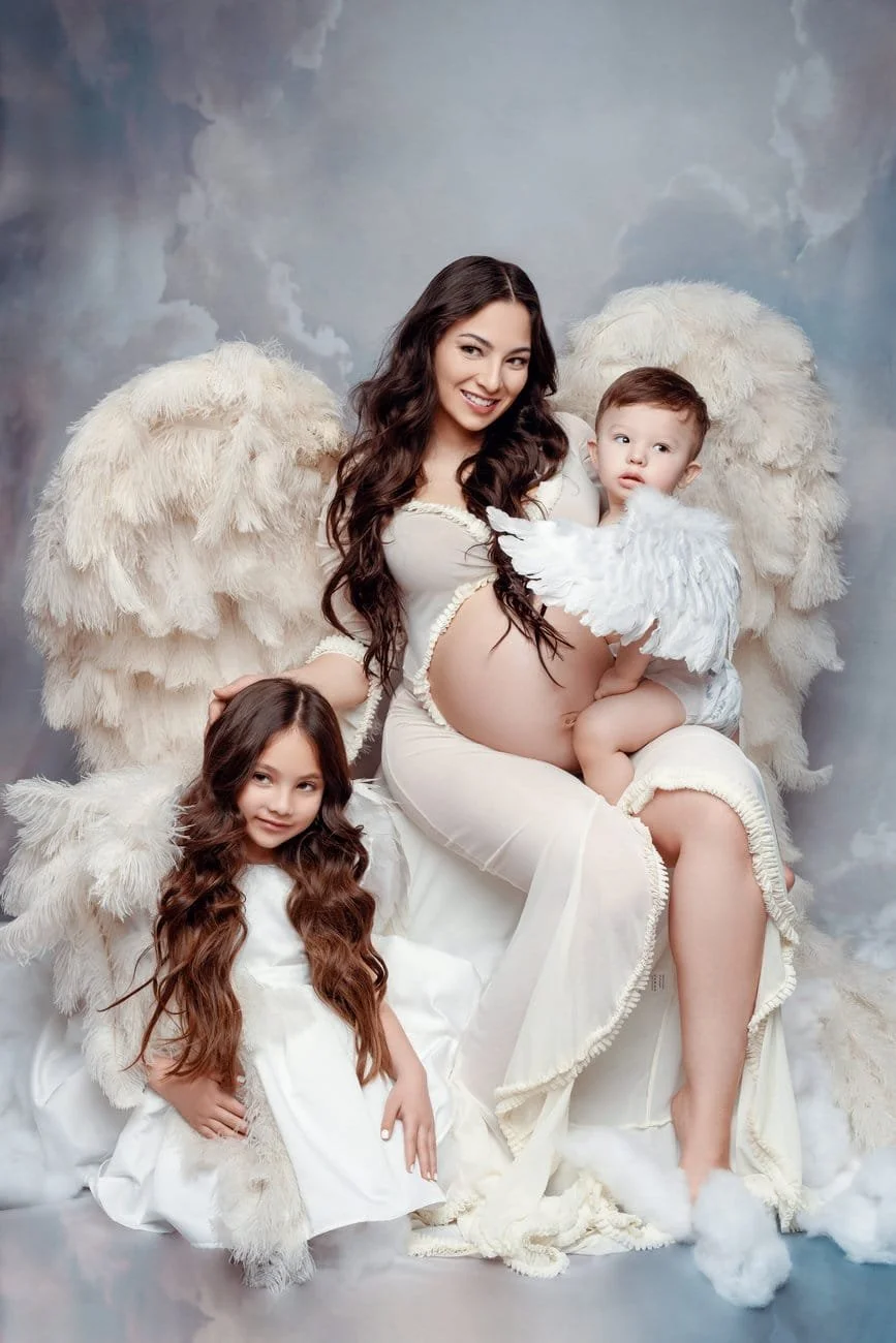 Maternity photoshoot with seated angel family maternity portrait in Chicago - Filaneyka photo studio