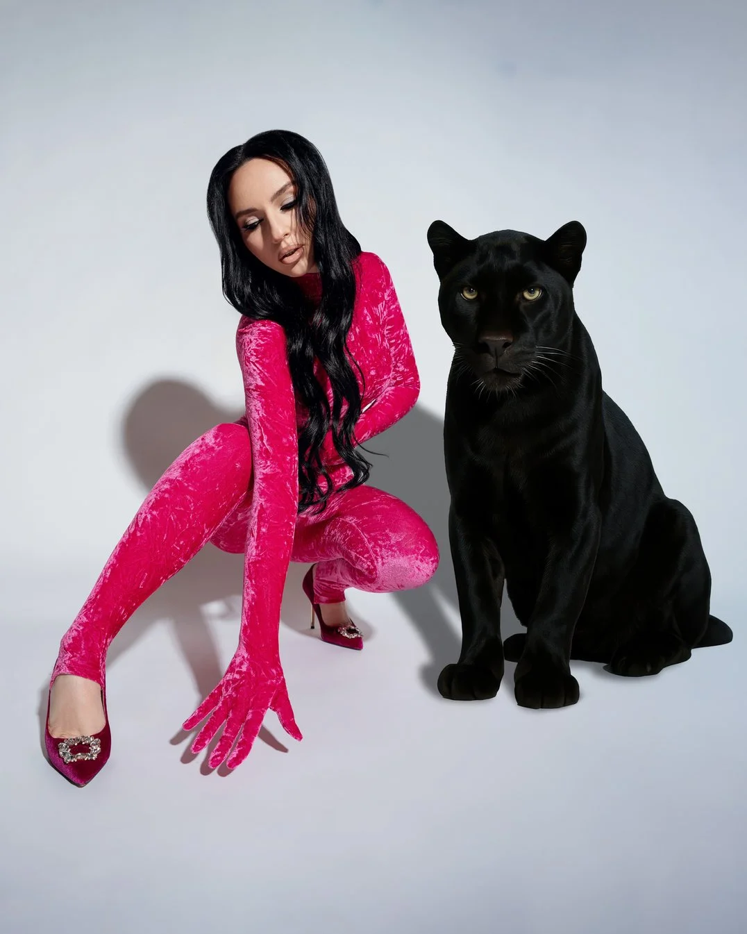 Studio headshot session with pink catsuit with black panther prop in Chicago - Filaneyka photo studio