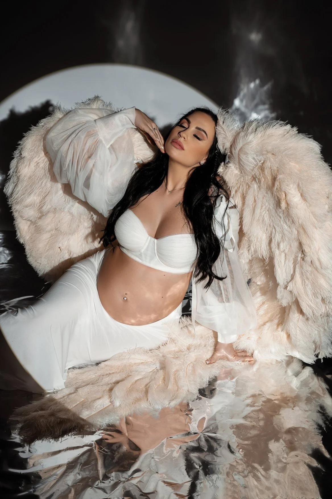 Prenatal photography session with pregnant angel lying on mirror in Chicago - Filaneyka photo studio