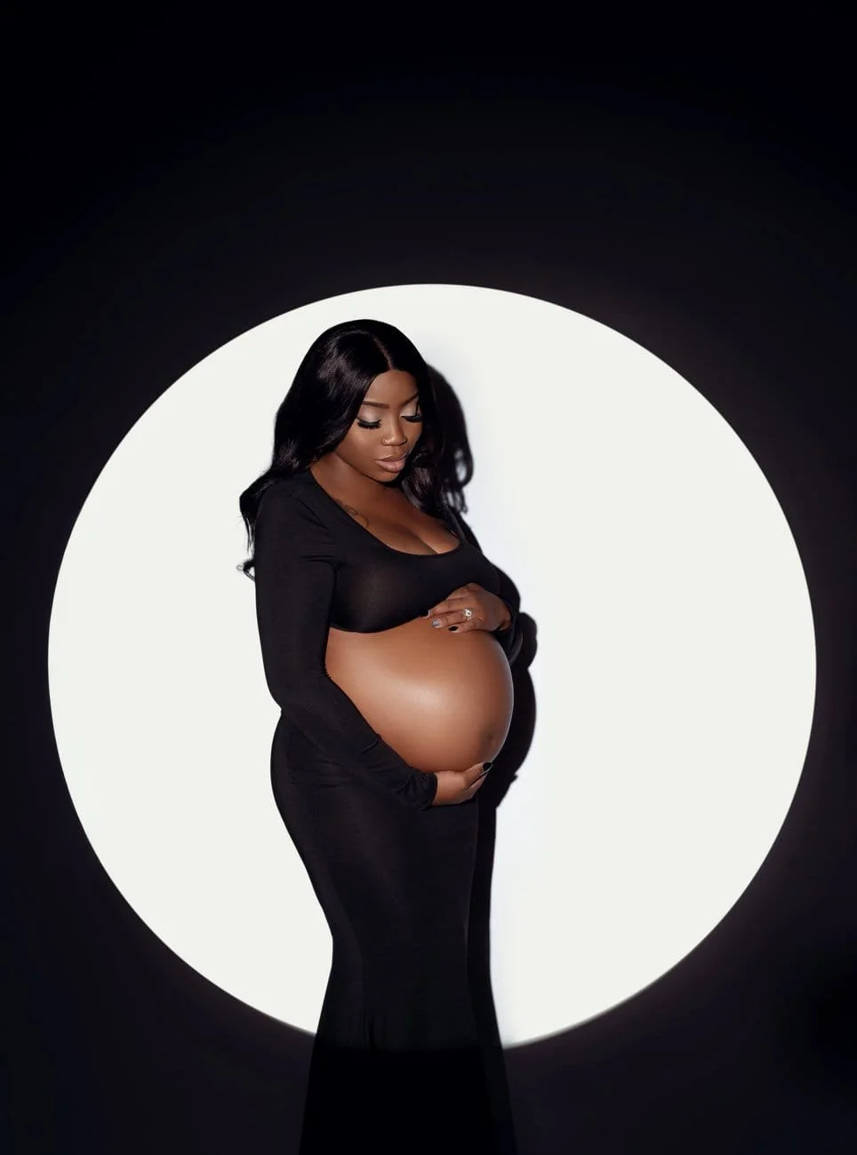 Prenatal photography session with moonlit pregnant woman in black in Chicago - Filaneyka photo studio