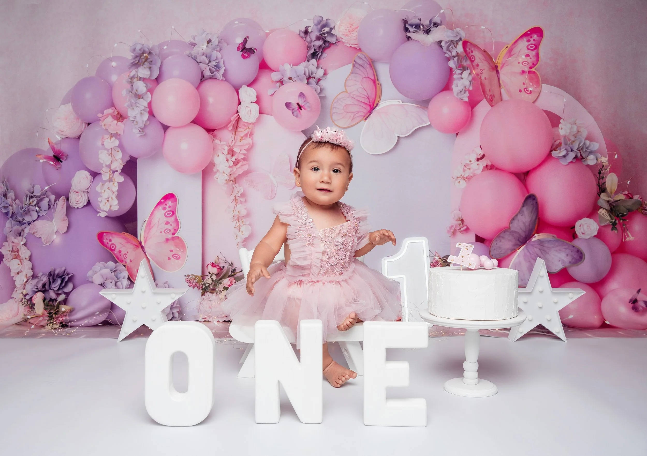 1st birthday photography with baby girl sitting with ONE sign in Chicago - Filaneyka photo studio