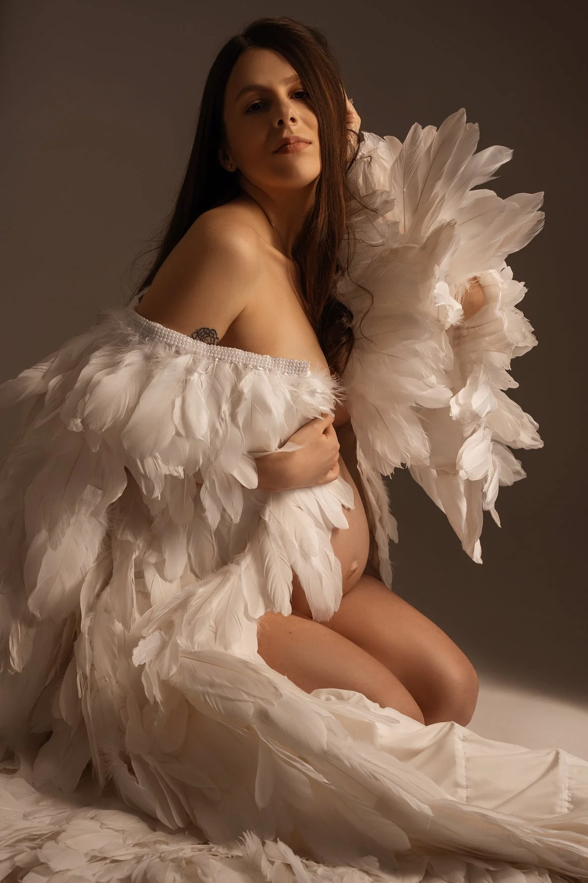 Maternity portrait session with pregnant woman with angel wings in Chicago - Filaneyka photo studio