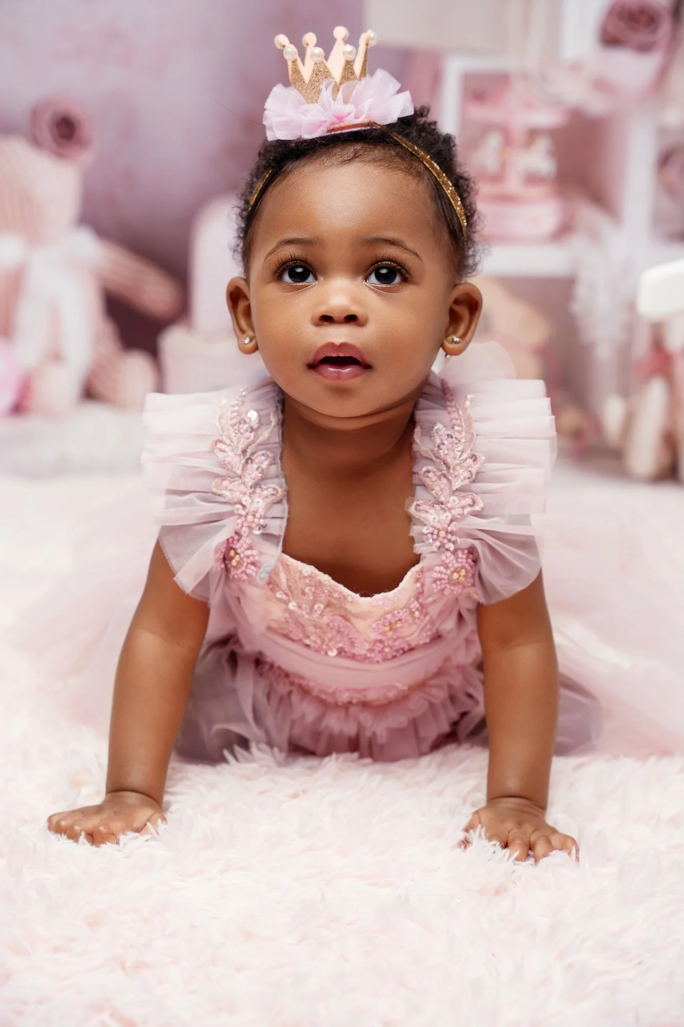 Luxury first birthday photoshoot: baby girl in a pink tutu