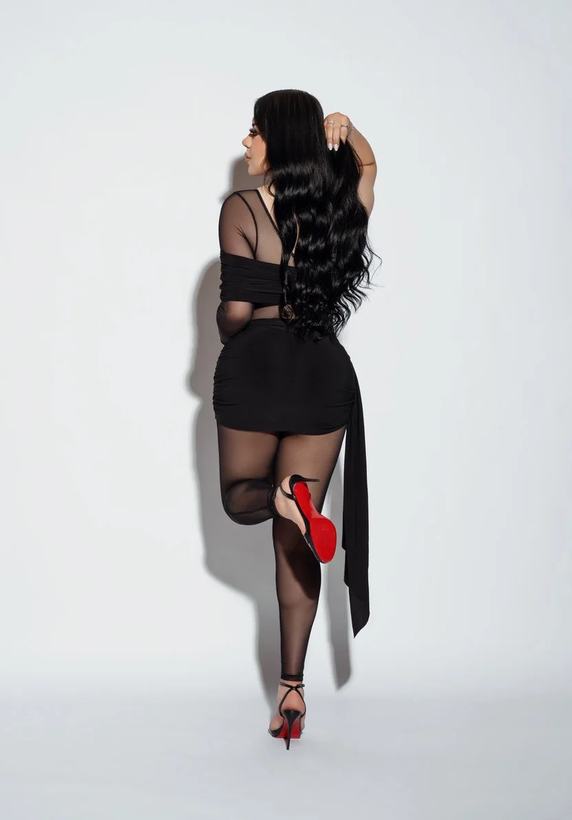 Studio headshot session with back view in black dress and heels in Chicago - Filaneyka photo studio