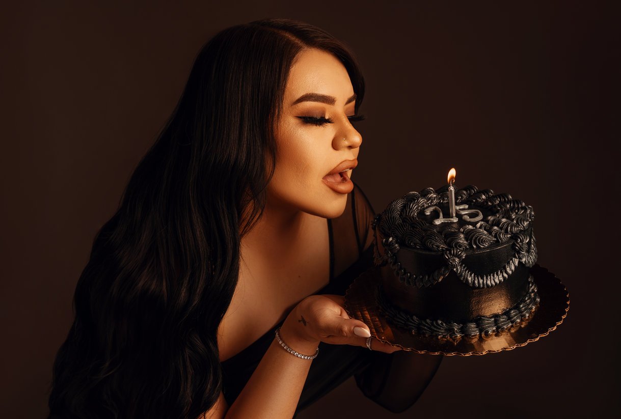 Birthday photoshoot with woman blowing out birthday cake in Chicago - Filaneyka photo studio