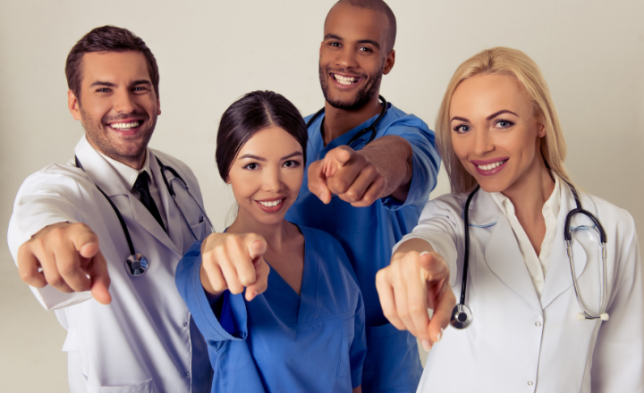 Healthcare professionals discussing radiation oncology billing solutions in a meeting.