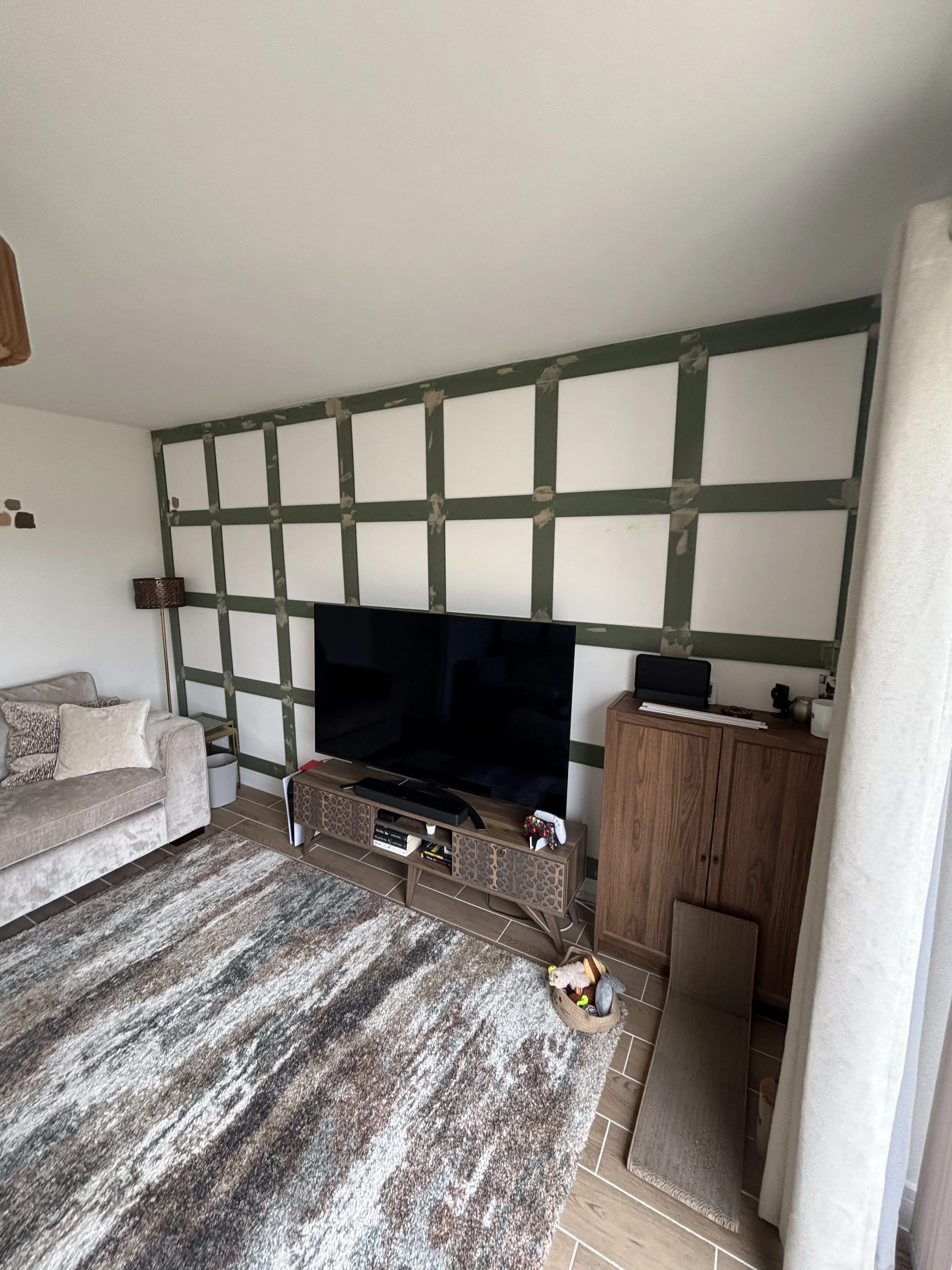 full square living room feature leading to half height panelling in hall ways