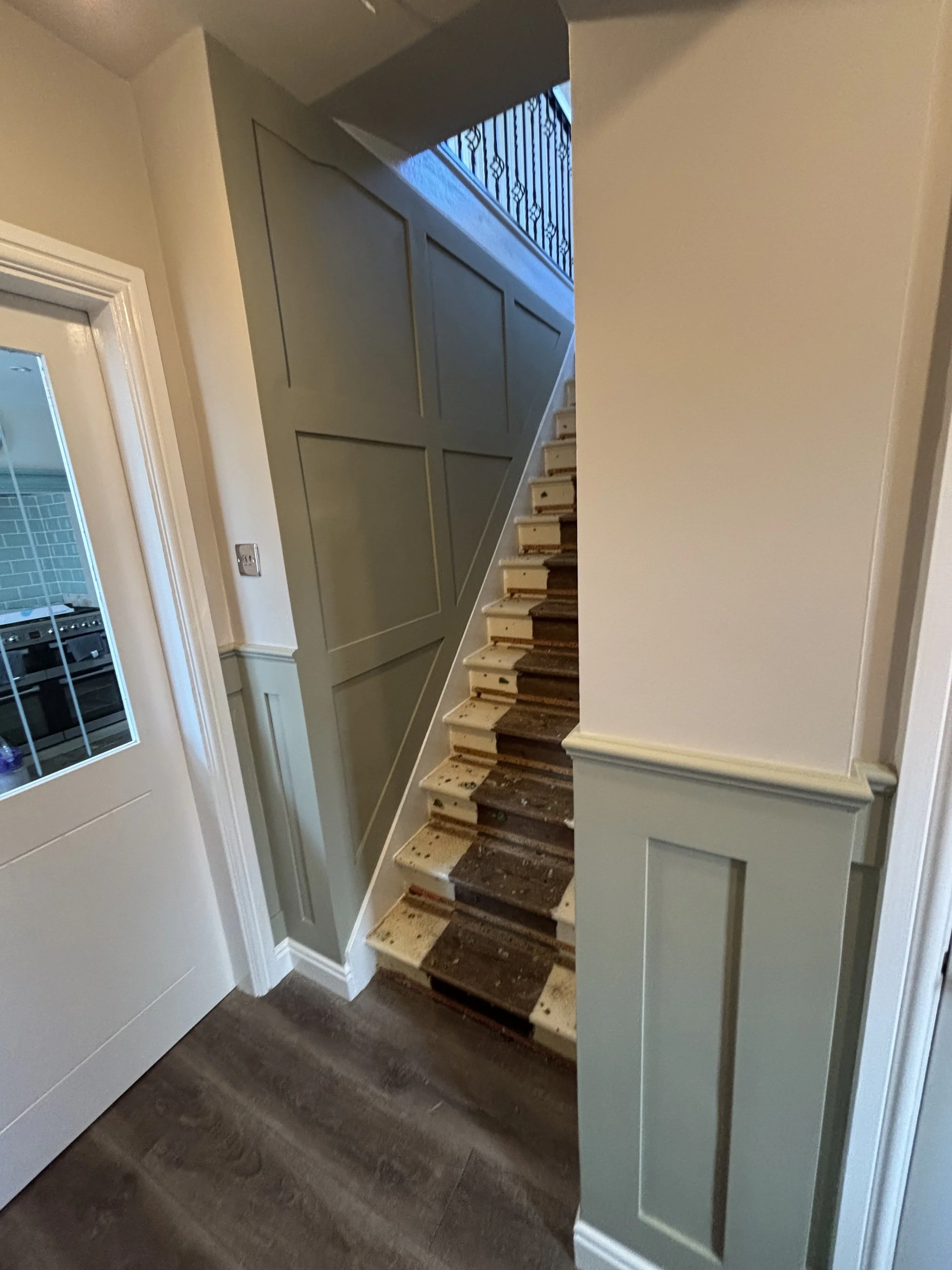 half height shaker on hall stairs and landing with a feature wall