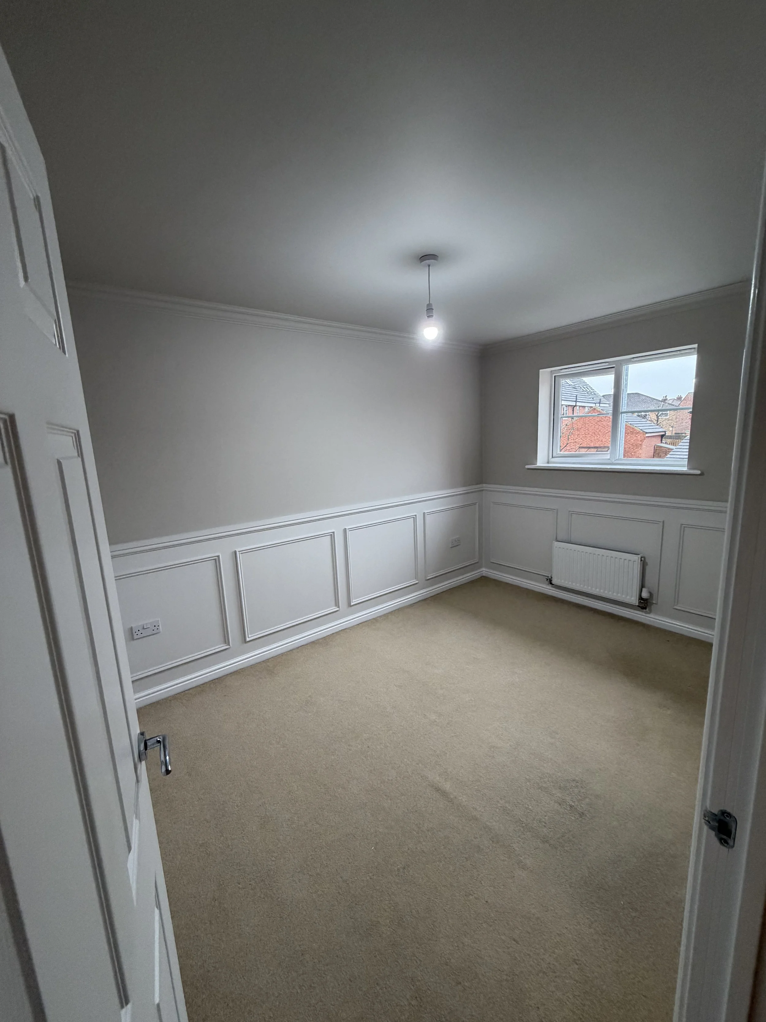 Half height beaded panelling in bedroom