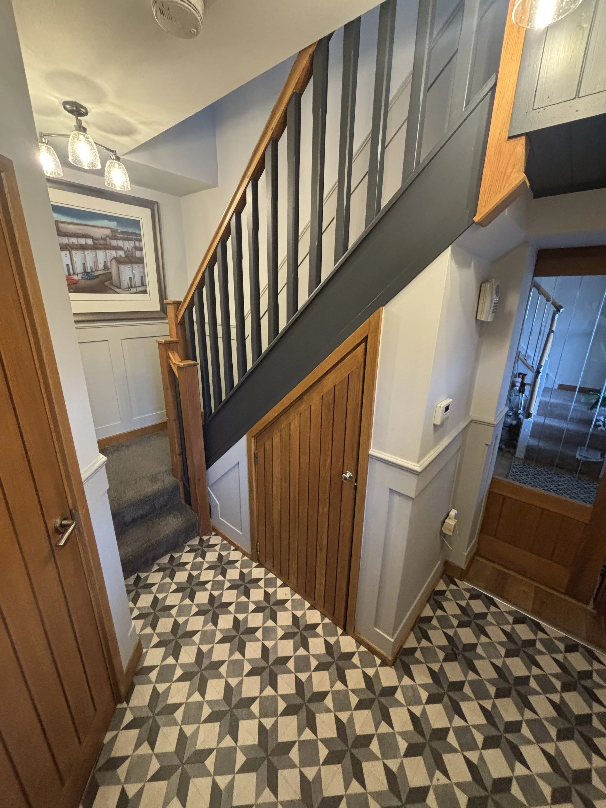 Half height shaker panelling in hall stairs and landing