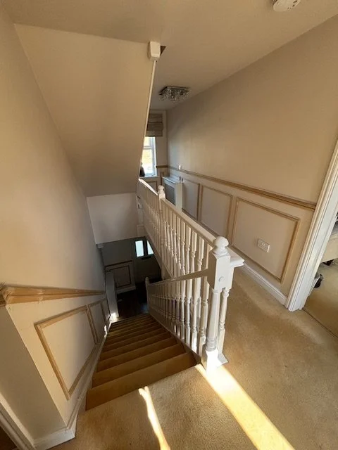 half height beaded panelling on double staircase 