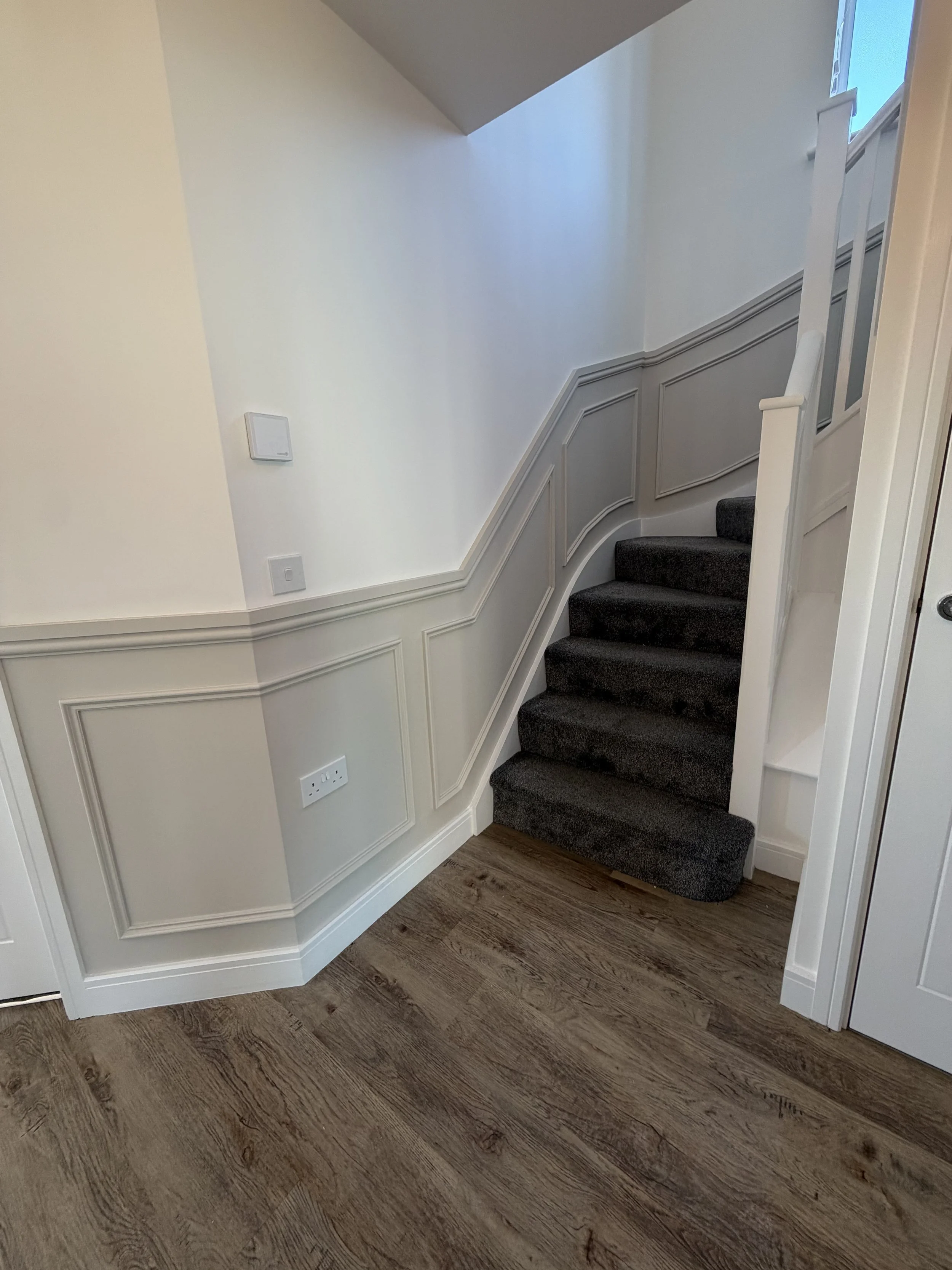 Half height beaded panelling on hall stair and landing 