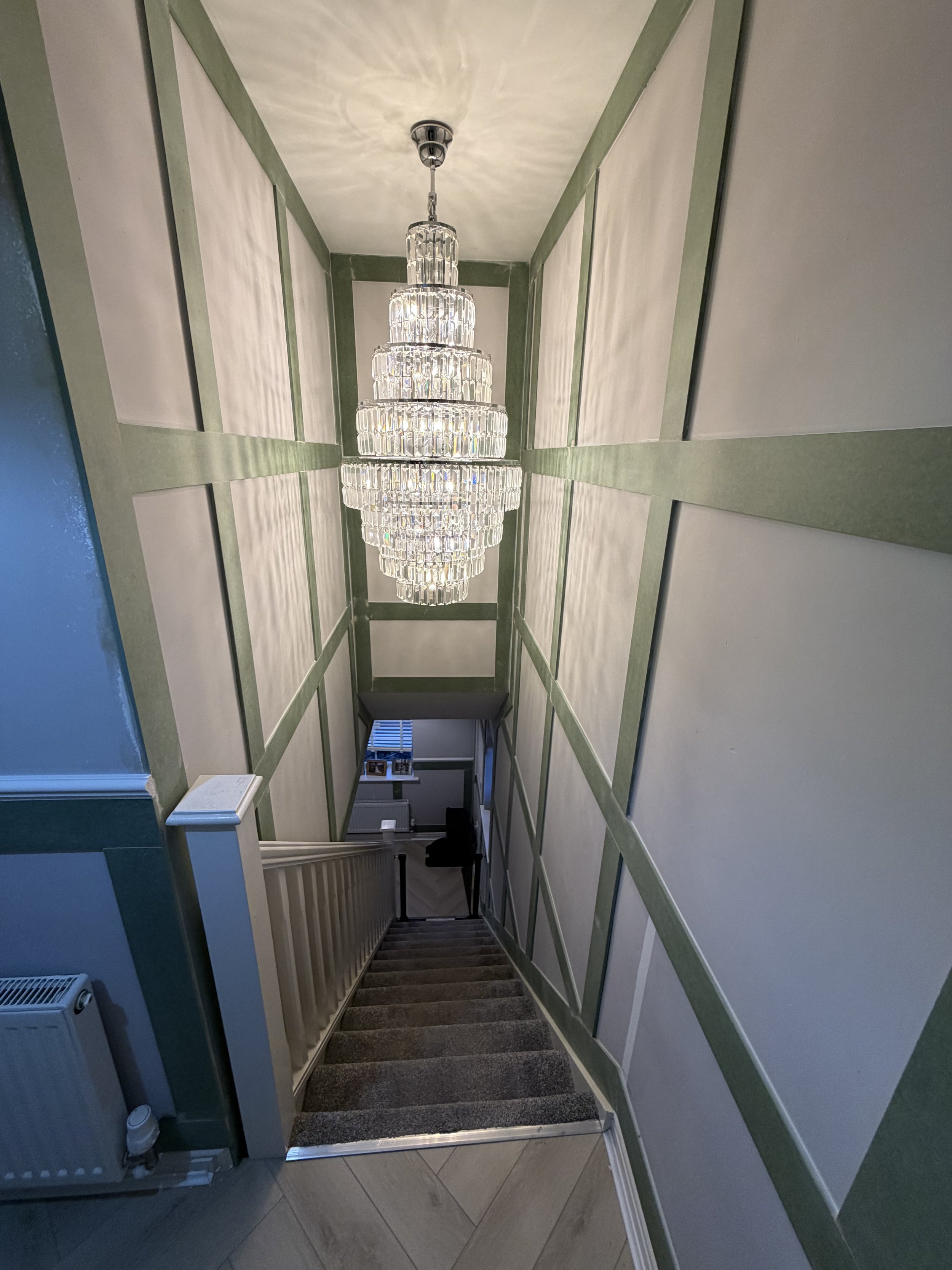 Full square panelling on feature staircase with half height shaker on the hall stairs and landing