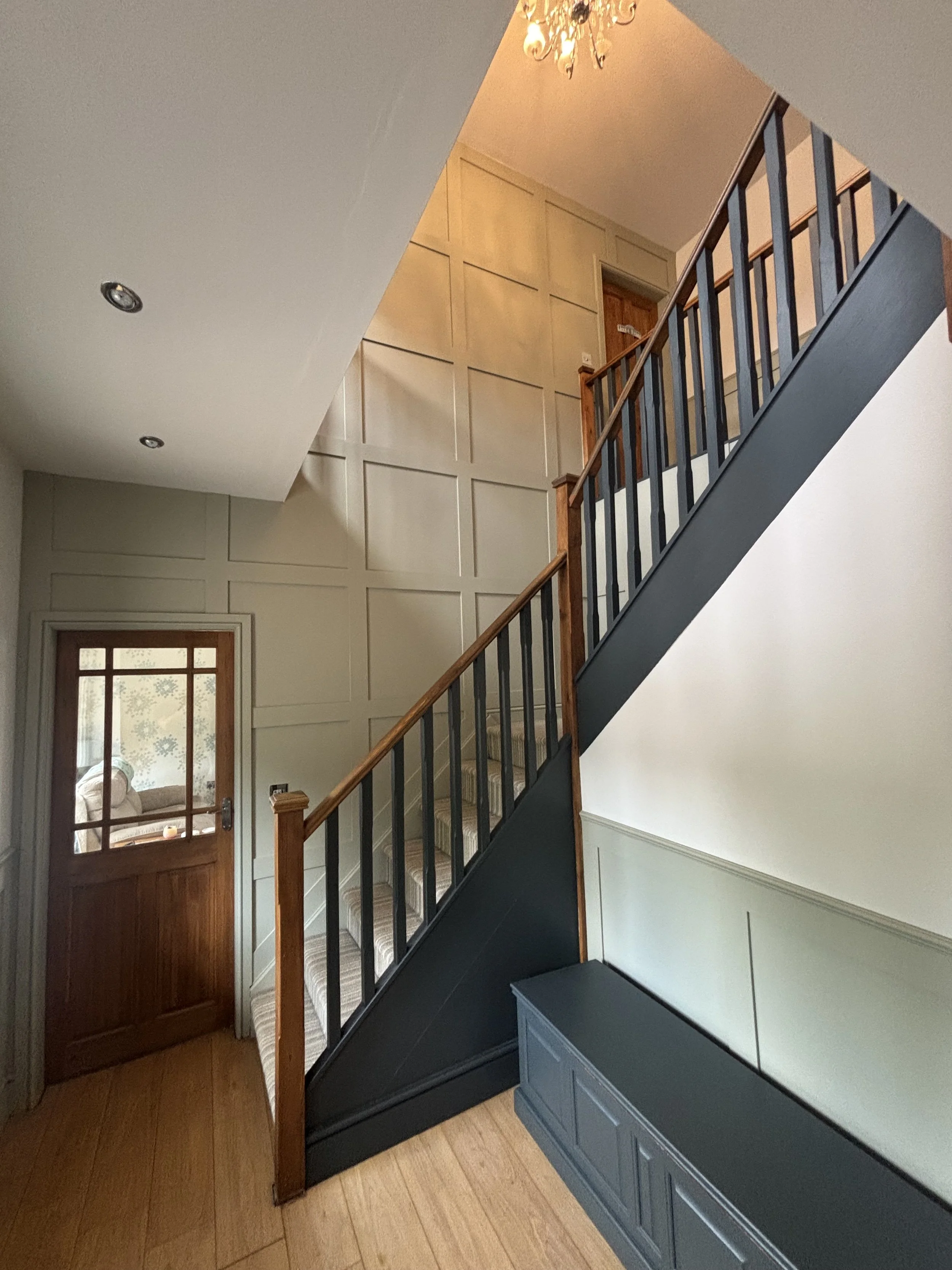 Full square panelling on a feature wall on the gallery staircase with half height shaker panelling