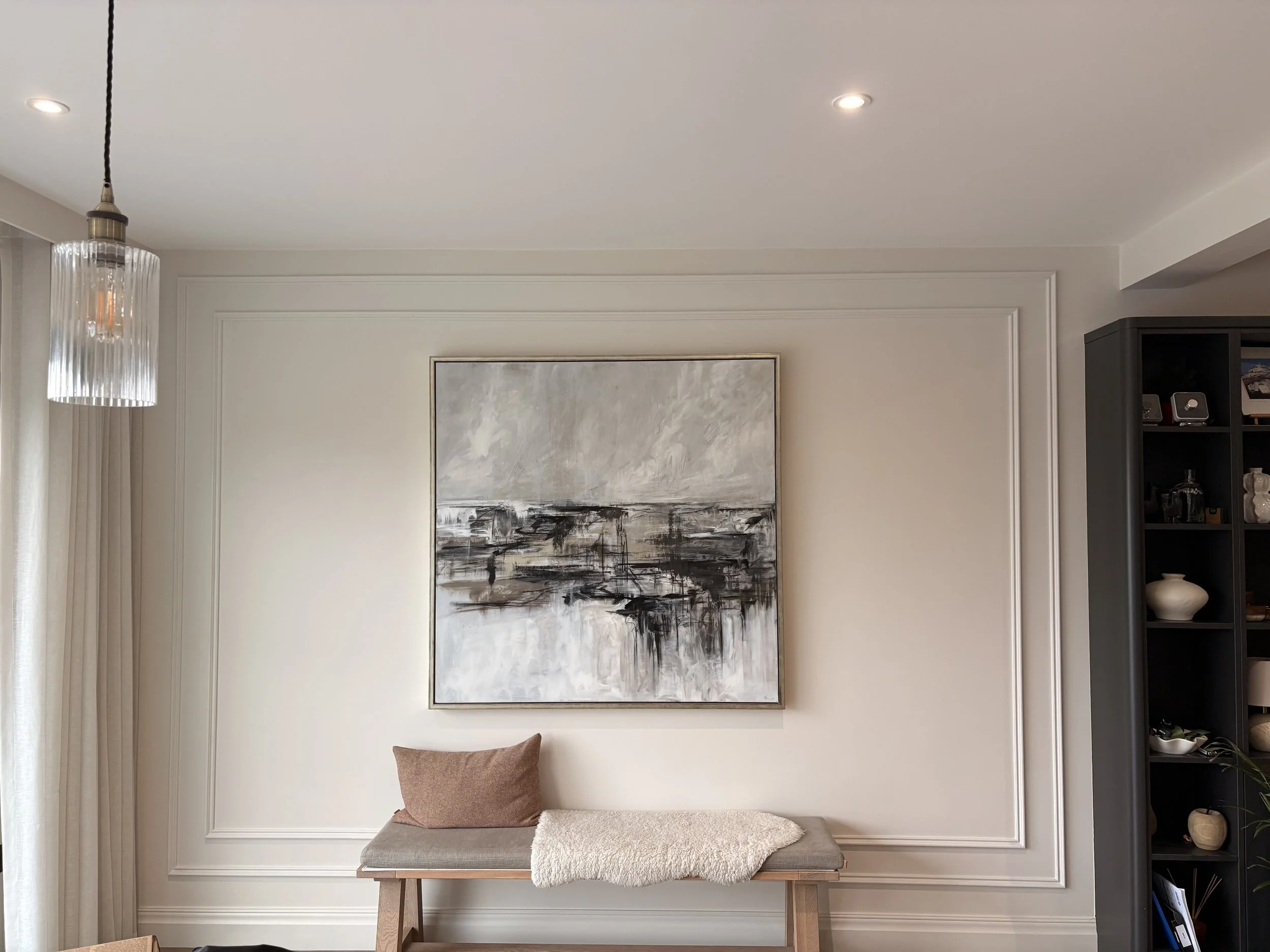 Double beaded panelling in lounge framing imagery and giving aesthetic appeal to the space