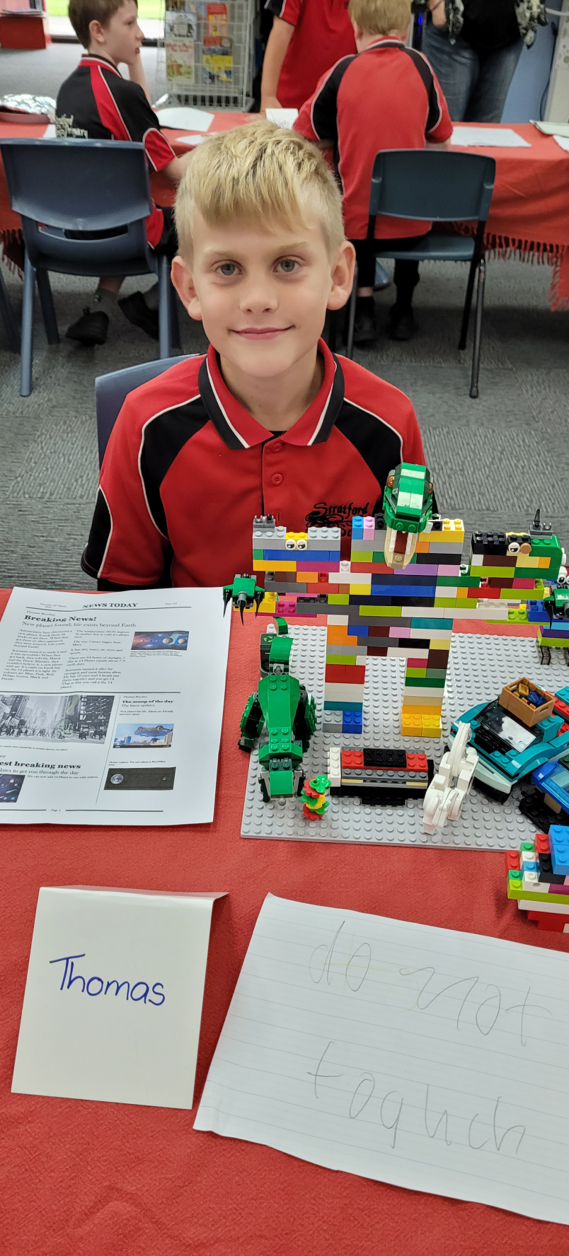 stratford student dennis with athletics materials