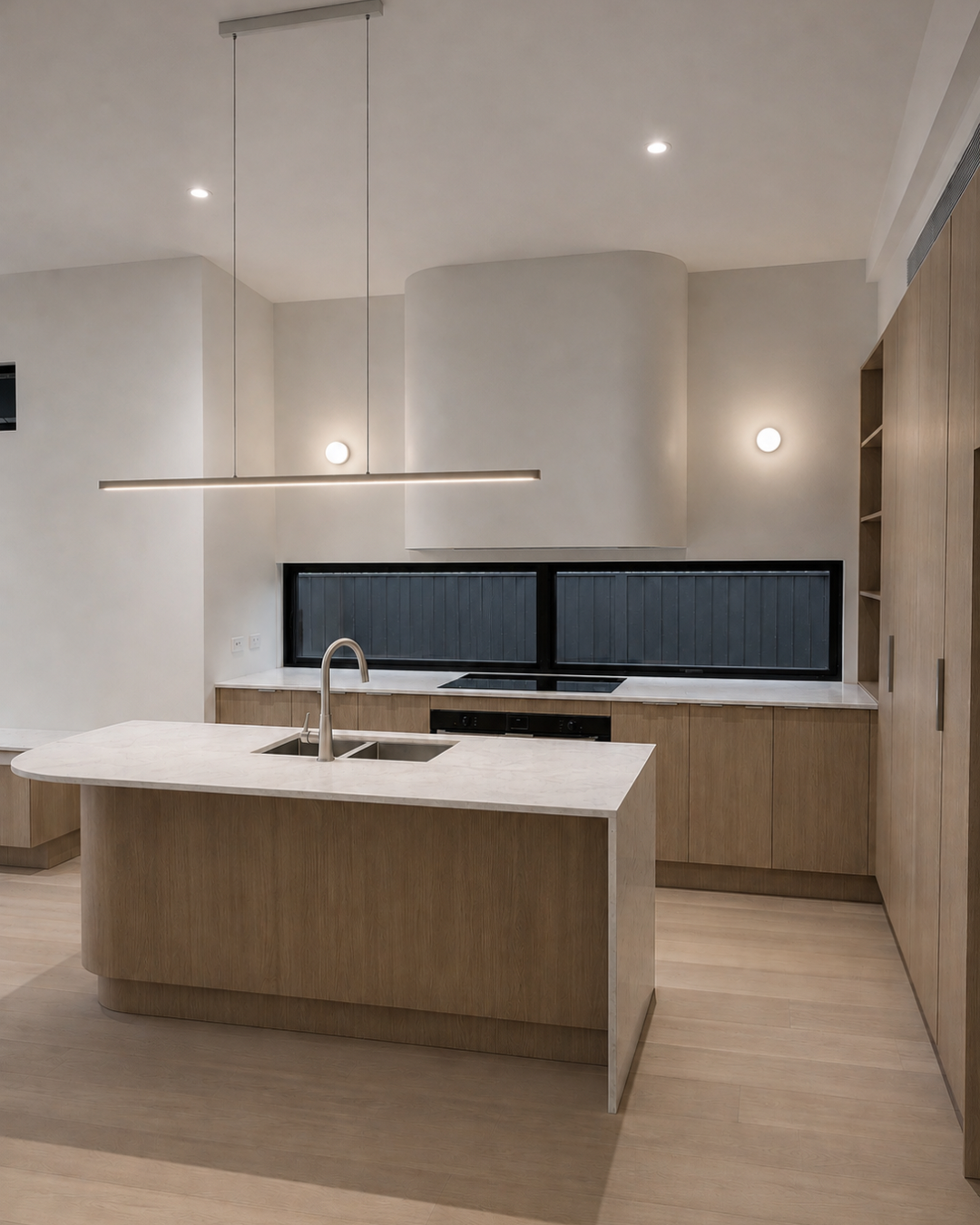 Kitchen island, pendant lighting and curved rangehood — Chambers Road, Altona North.