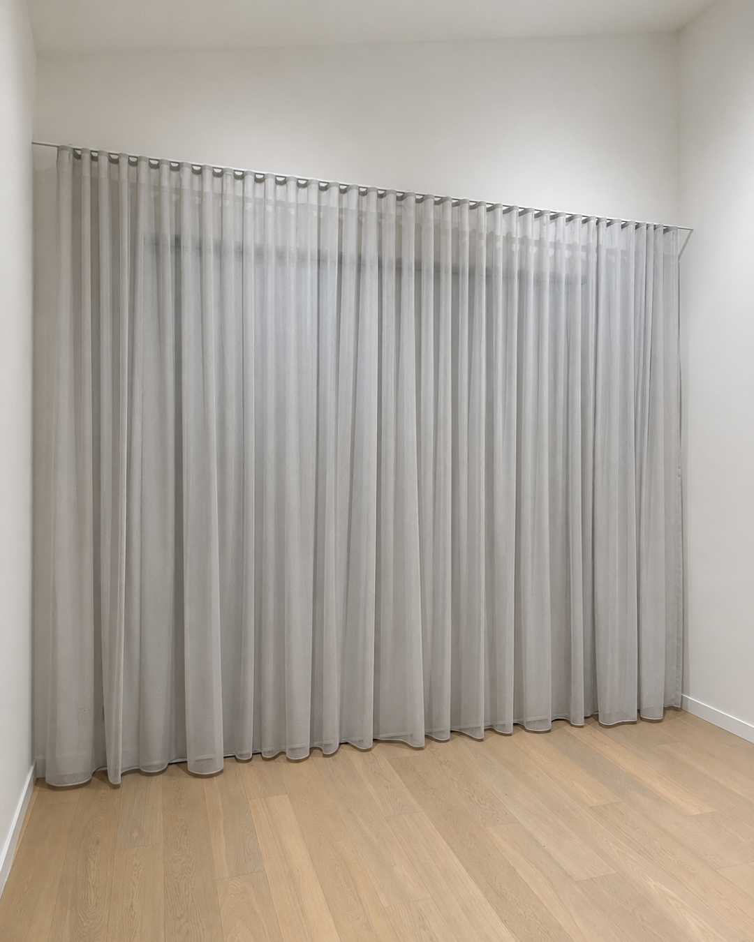 Sheer curtains beneath a raked ceiling — Chambers Road, Altona North.
