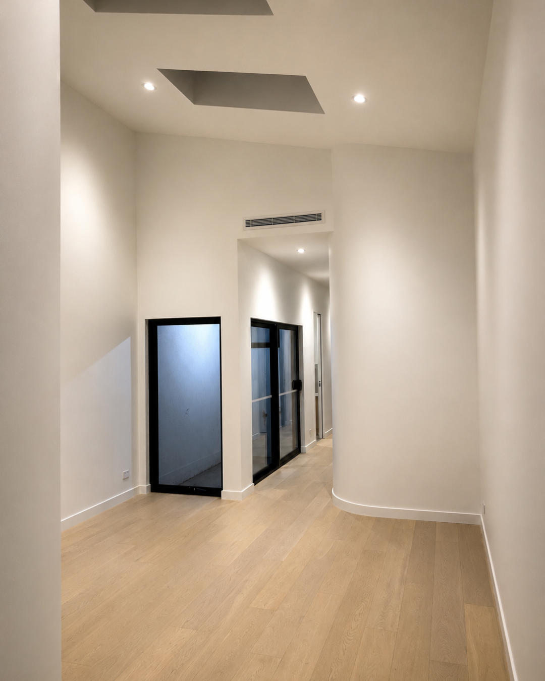 Entry with curved wall and skylights — Chambers Road, Altona North.