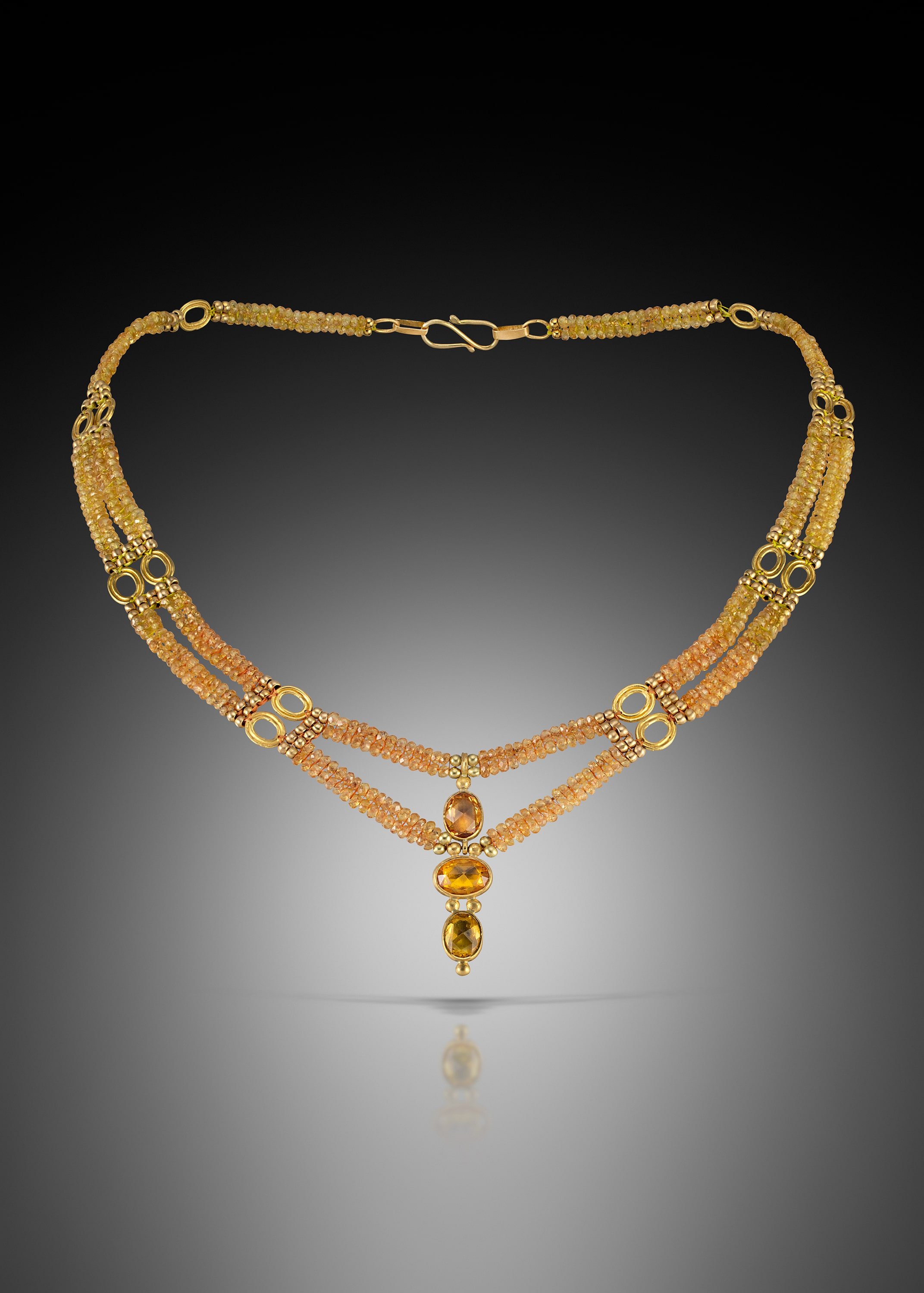 Yellow Sapphire Collar.  The collar is hand woven of yellow sapphire, and 20k gold beads with 22k gold charms; the pendant is hand fused and fabricated of rose cut yellow sapphires set in 22k gold.